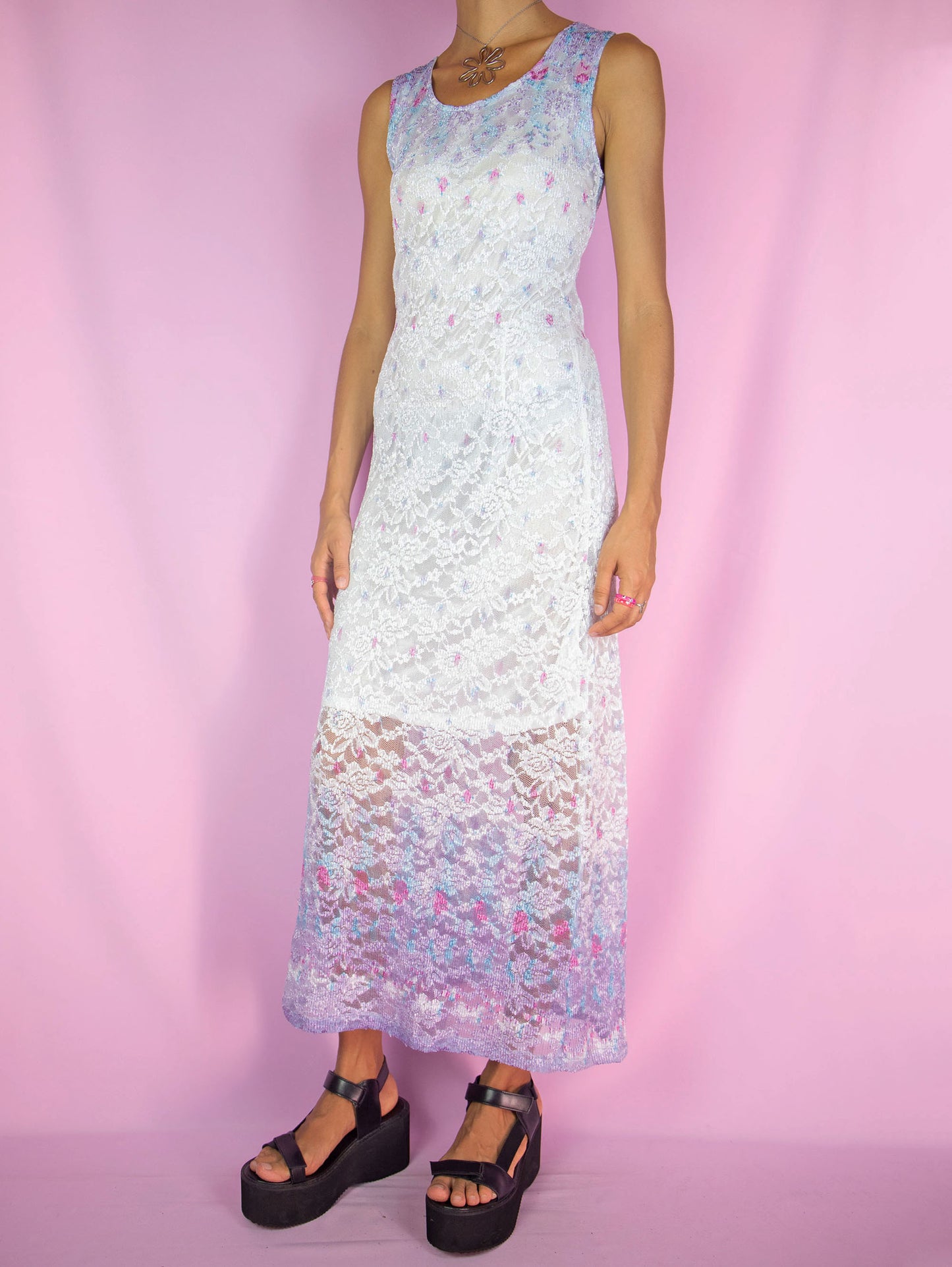 The Y2K White Lace Maxi Dress is a vintage 2000s romantic summer party style sleeveless semi-sheer midi dress that is tied at the back.