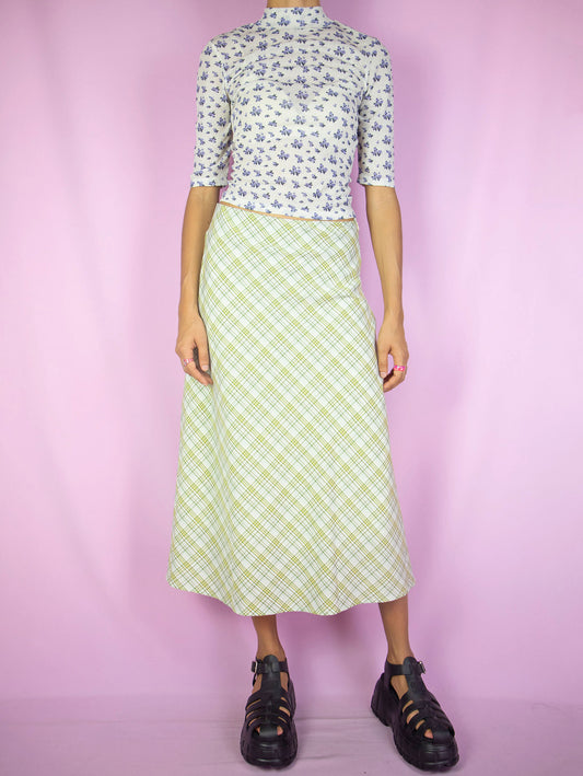 The Y2K Plaid Print Midi Skirt is a vintage 2000s boho preppy inspired beige, yellow and green checkered maxi skirt with side zipper closure.