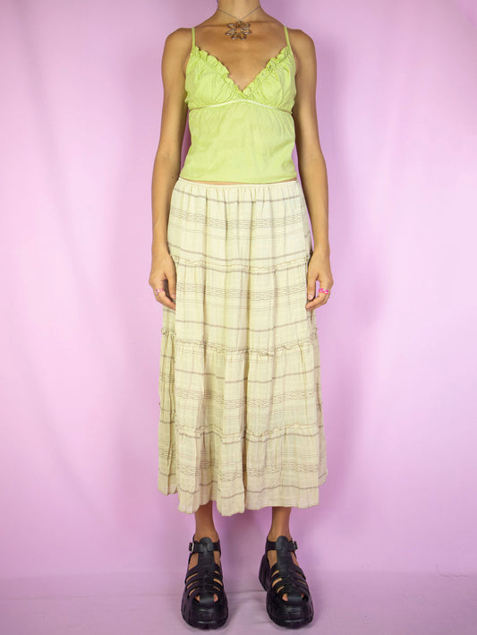 The Vintage 90s Beige Tiered Midi Skirt is a boho cottage prairie inspired striped peasant midi skirt with an elastic waist.