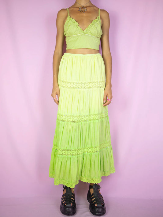 The Y2K Green Tiered Maxi Skirt is a vintage 2000s boho summer beach party style neon lime green gradient peasant midi skirt with elastic waist and sequin detail.