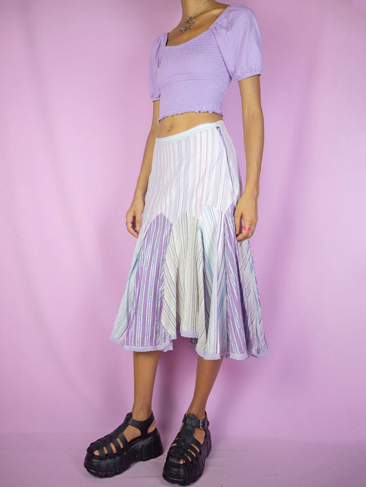 The Y2K Godet Trumpet Midi Skirt is a vintage 2000s romantic fairy inspired pastel purple lilac multicolored striped print skirt with side zipper closure.