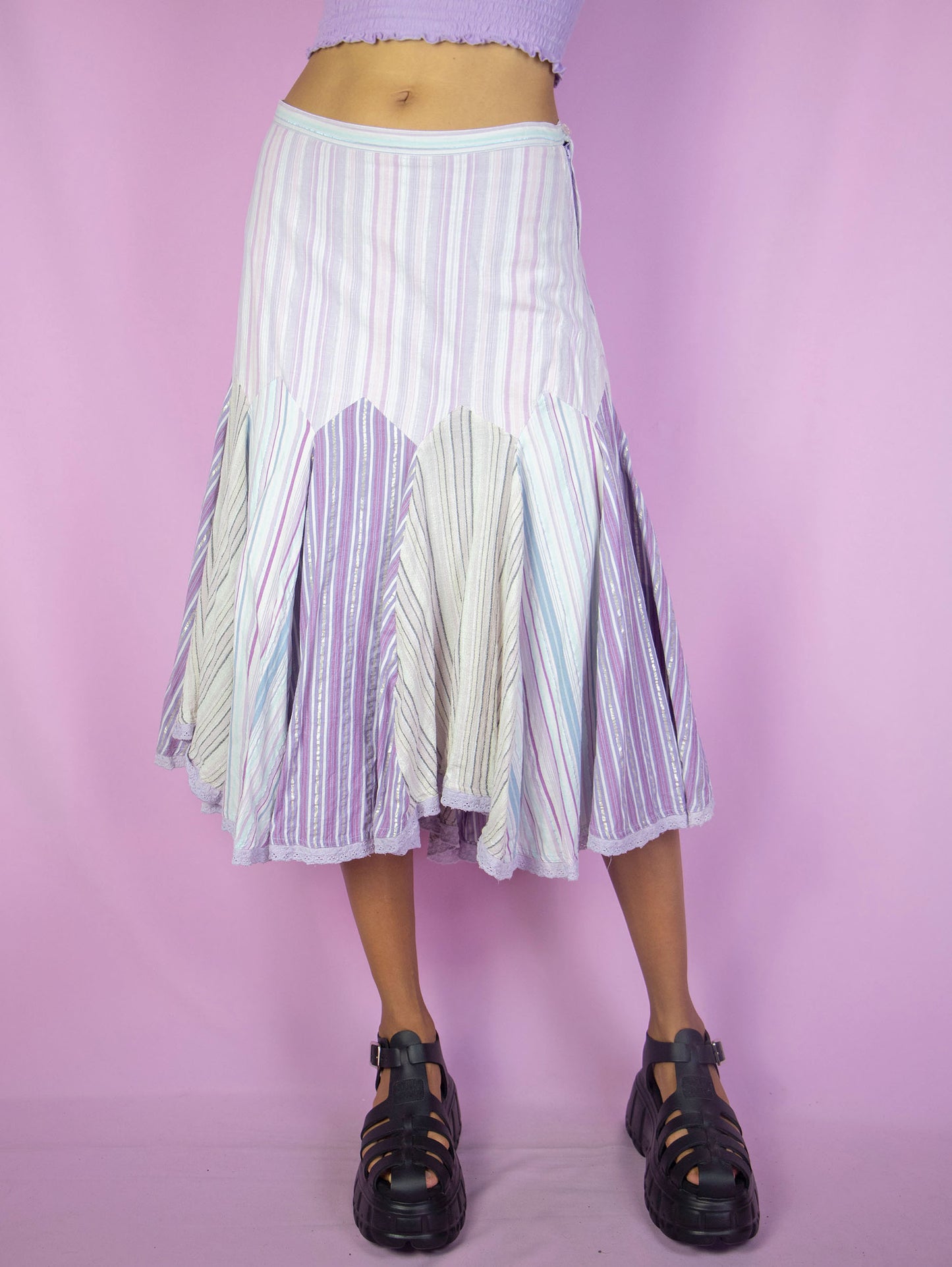 The Y2K Godet Trumpet Midi Skirt is a vintage 2000s romantic fairy inspired pastel purple lilac multicolored striped print skirt with side zipper closure.