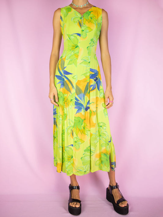 The Vintage 90s Boho Floral Midi Dress is a green multicolor floral sleeveless flared dress with side zipper closure and buttons down the front. Retro summer 1990s flowy maxi dress.