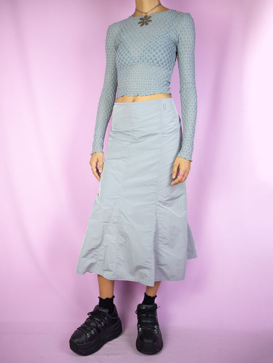 The Y2K Gray Parachute Midi Skirt is a vintage light gray paneled flared skirt with back zipper closure. Cyber goth grunge 2000s gorpcore subversive maxi skirt.