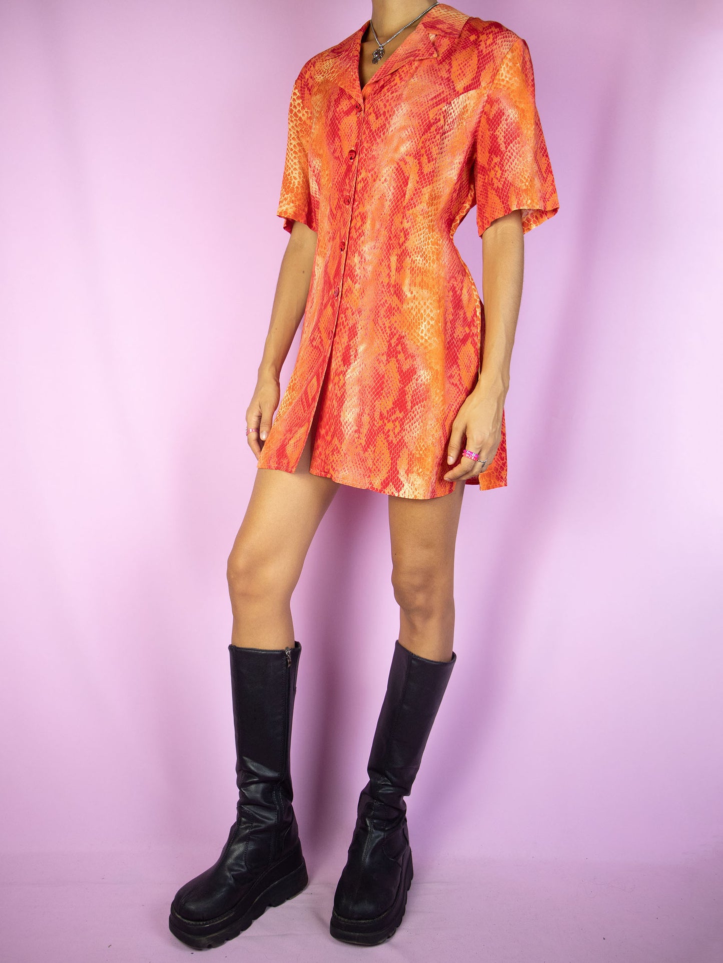 The Vintage 90s Red Snake Print Blouse is a short sleeve red and orange snake animal print top with a collar and buttons. Cyber summer festival 1990s party shirt.
