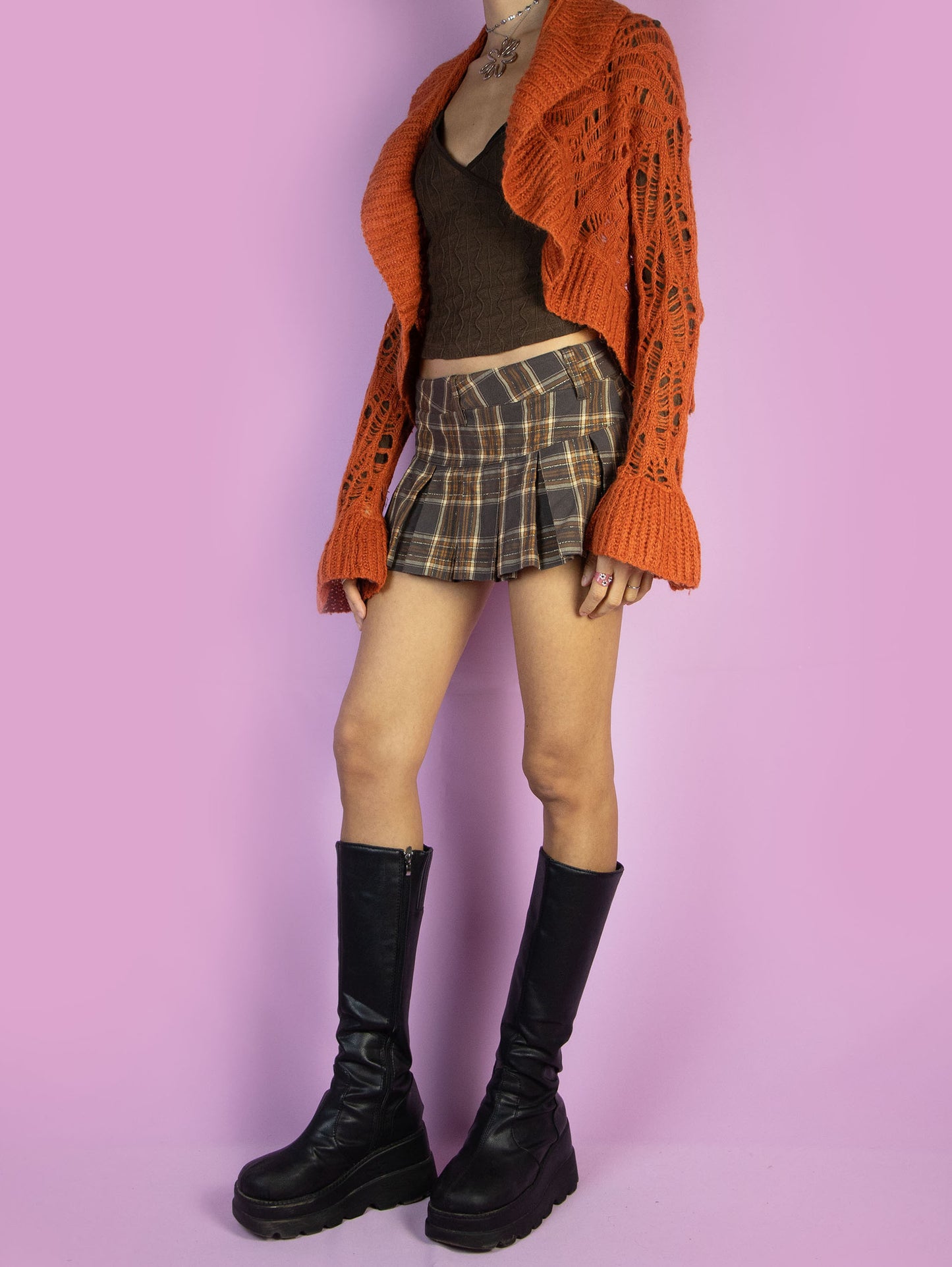 The Y2K Orange Knit Bolero Shrug is a vintage open orange cardigan with bell sleeves. Boho fairy grunge 2000s crochet knit bolero jacket.