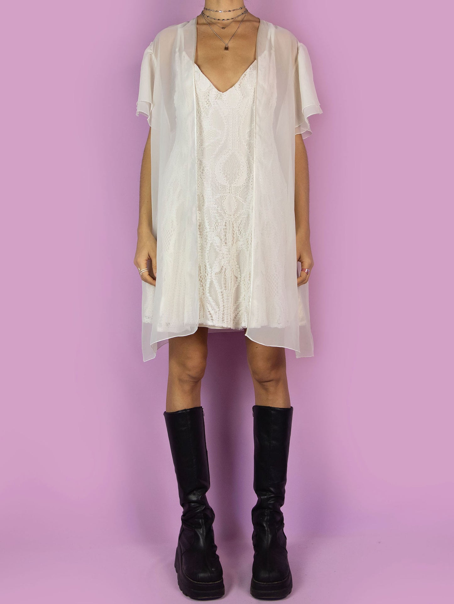 The Vintage 90s White Sheer Duster Robe is a romantic flowy semi-transparent peignoir jacket with short sleeves.