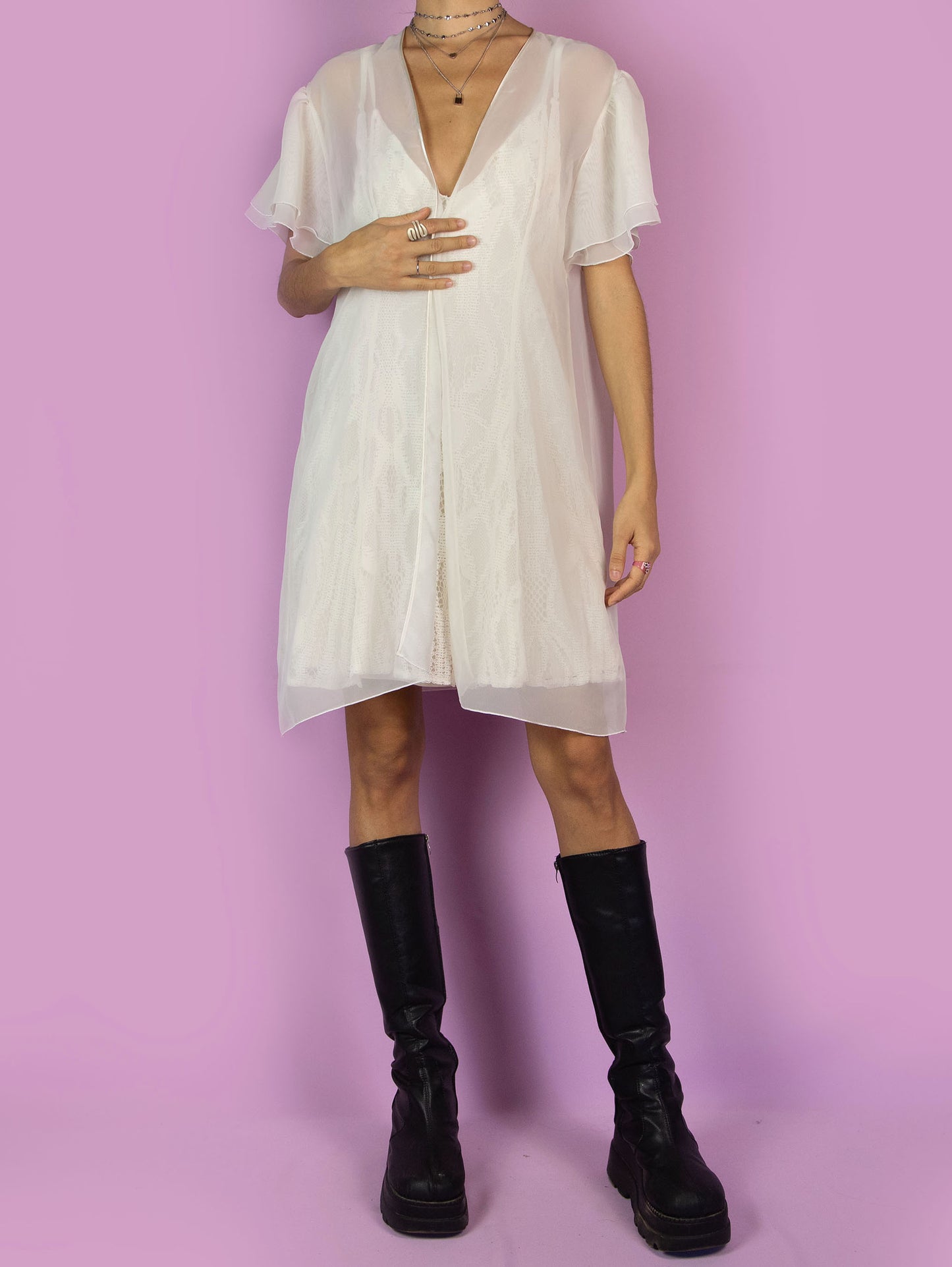 The Vintage 90s White Sheer Duster Robe is a romantic flowy semi-transparent peignoir jacket with short sleeves.