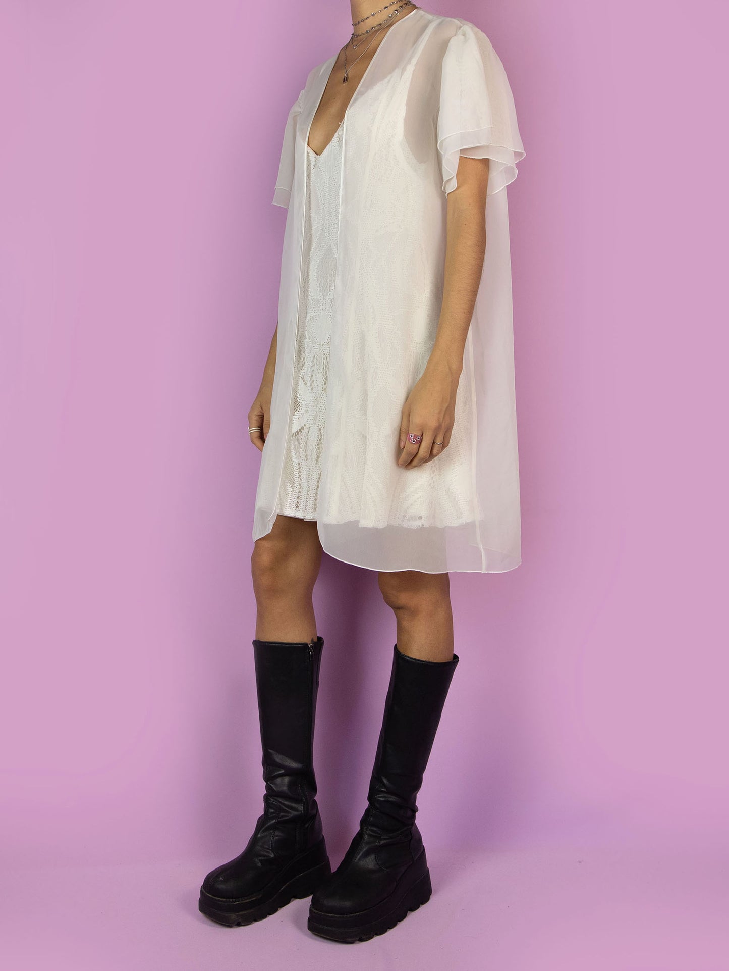 The Vintage 90s White Sheer Duster Robe is a romantic flowy semi-transparent peignoir jacket with short sleeves.