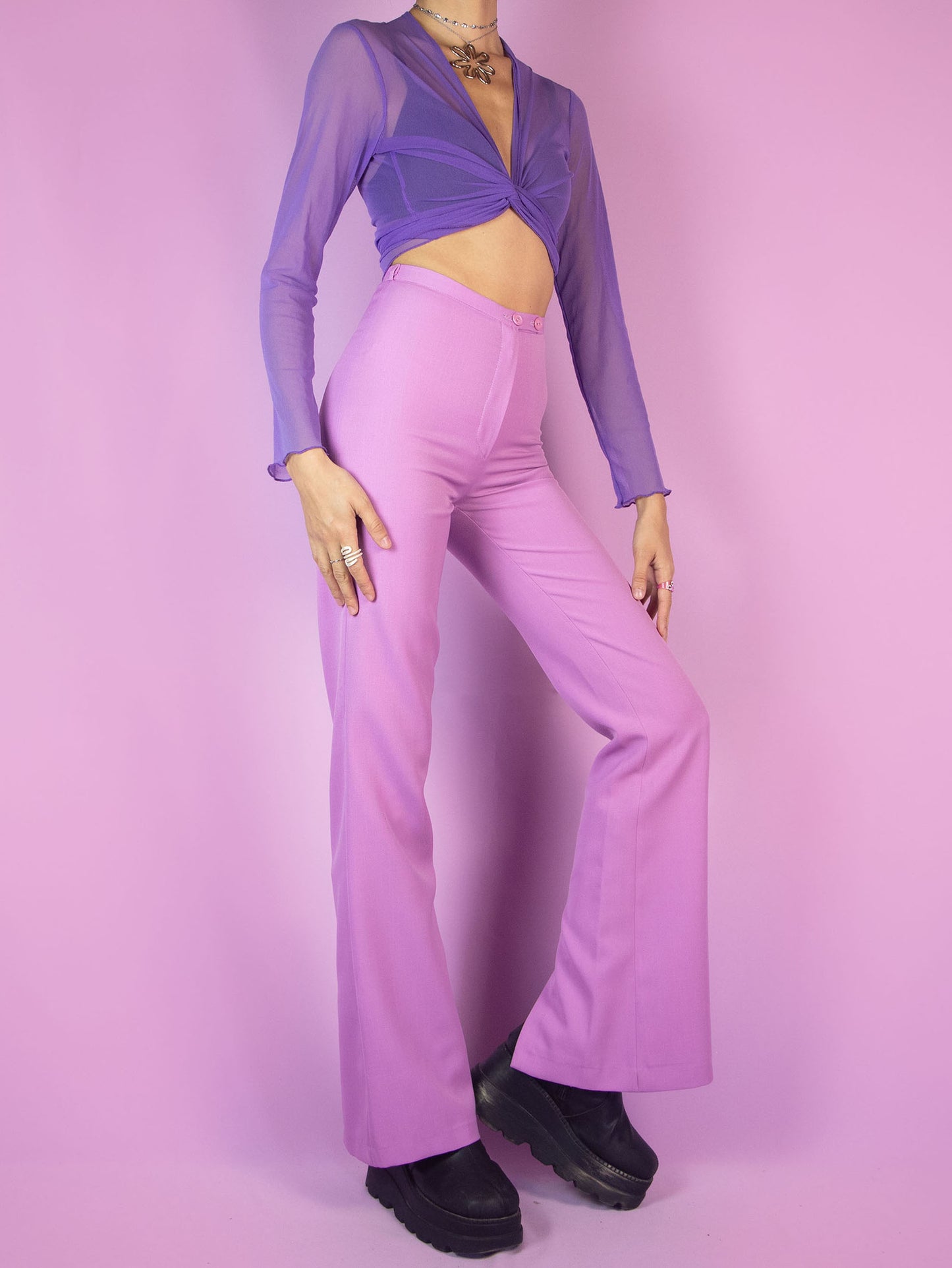 The Vintage 90s Pink Tailored Wide Pants are light pastel lilac high-waisted pants with a zipper closure and slits at the hem. Elegant evening party 1990s classic pleated trousers.