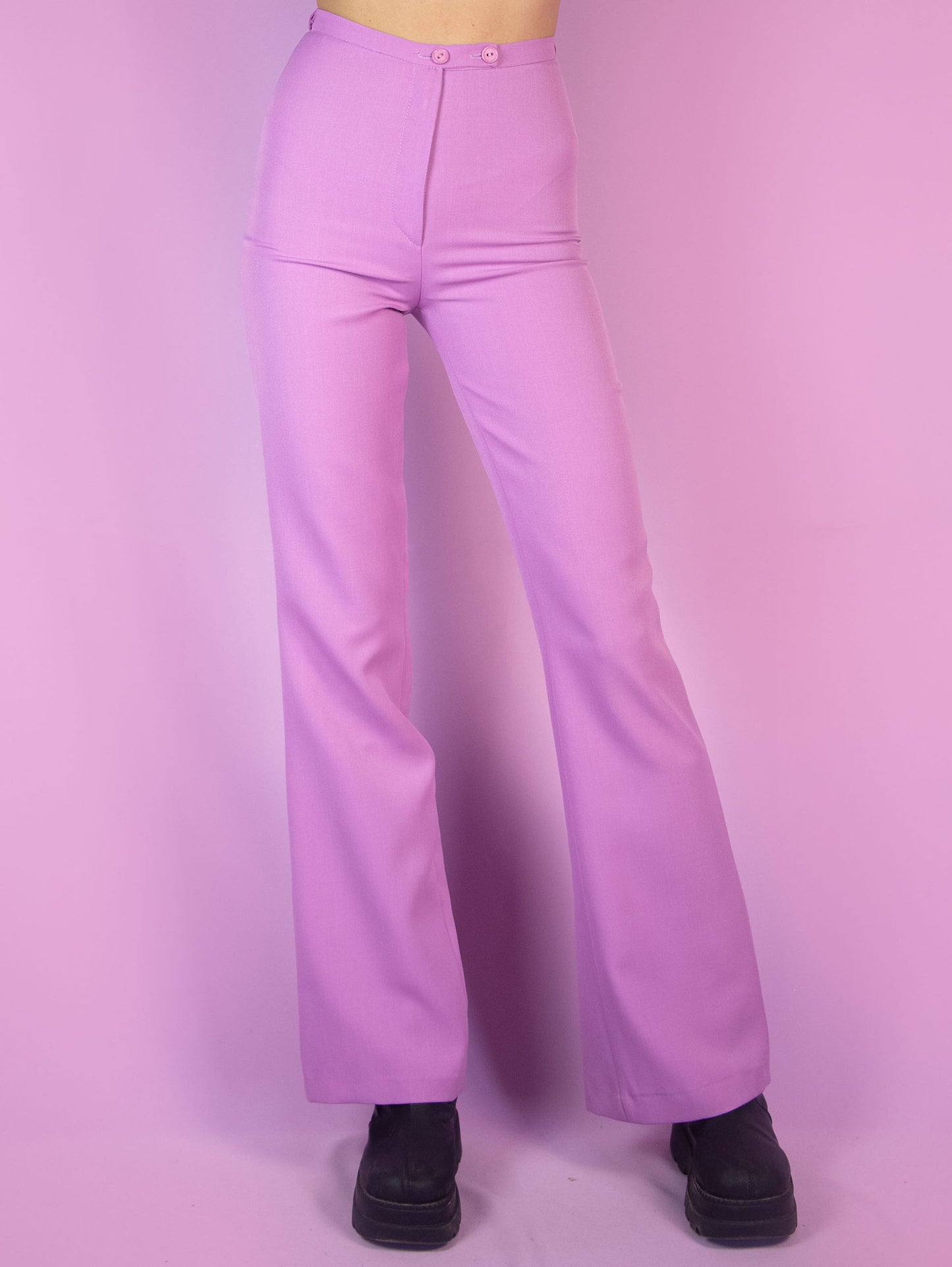 The Vintage 90s Pink Tailored Wide Pants are light pastel lilac high-waisted pants with a zipper closure and slits at the hem. Elegant evening party 1990s classic pleated trousers.