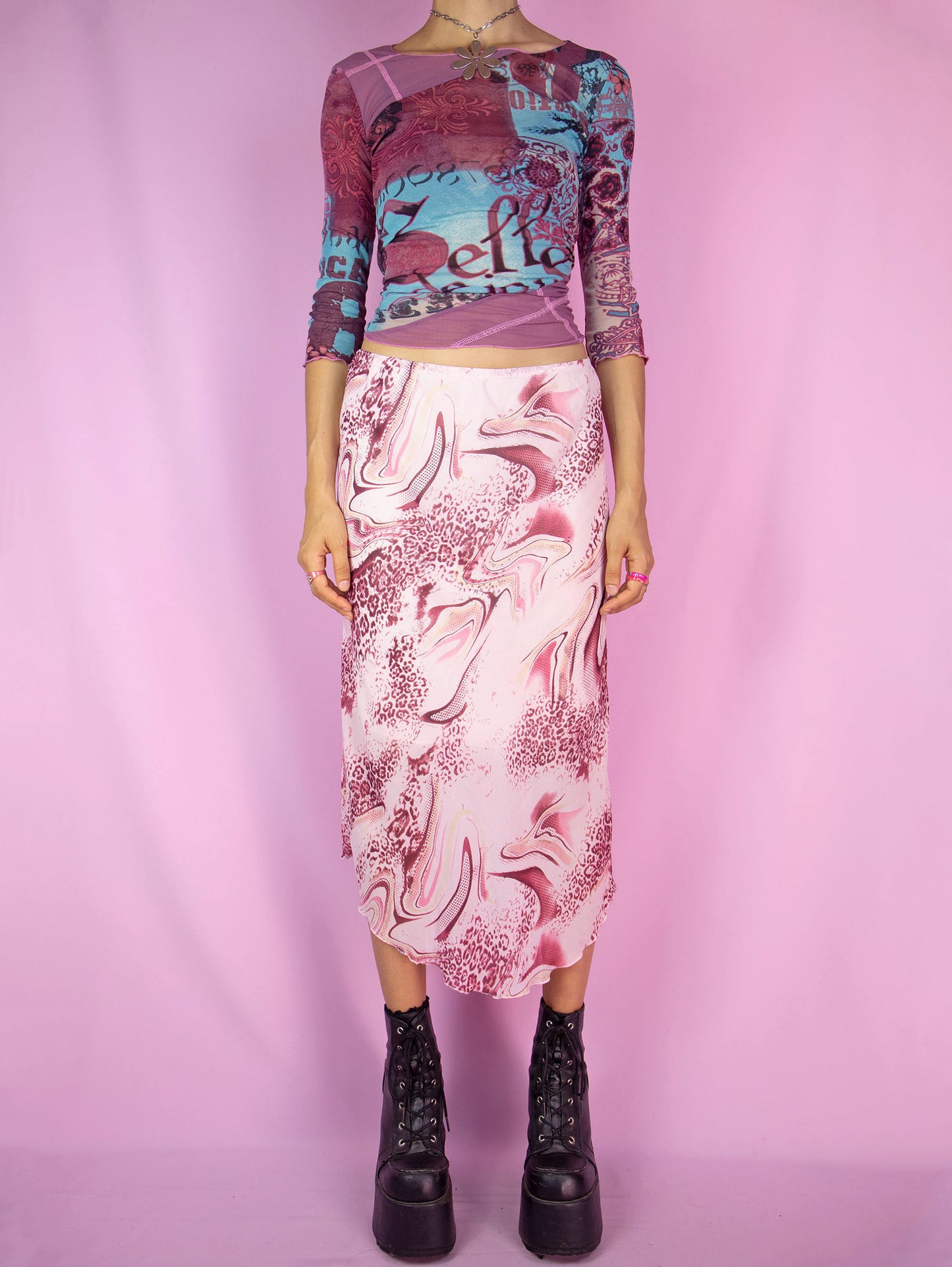 The Y2K Boho Pink Midi Skirt is a vintage pastel light pink and burgundy abstract print skirt with an elasticated waist and a pointed hem. Cyber fairy grunge 2000s summer maxi skirt.