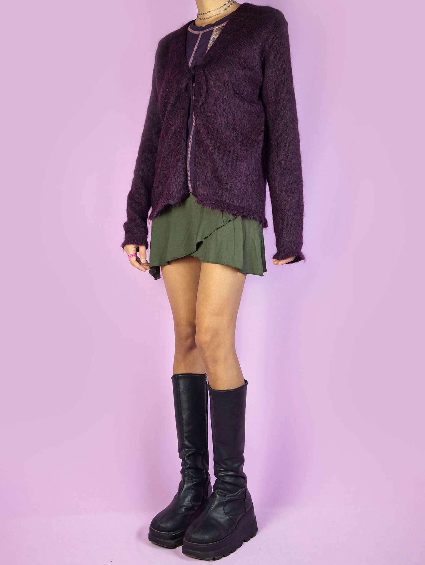 The Y2K Purple Tie Front Cardigan is a vintage 2000s dark purple mohair blend knit cardigan sweater featuring a tied front.