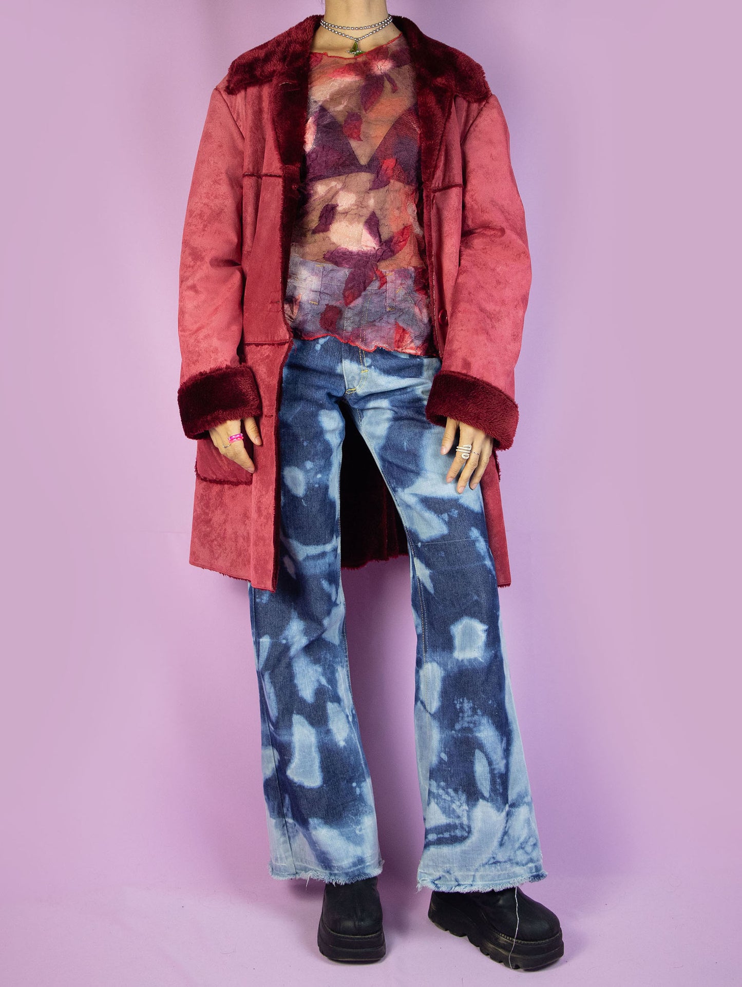 The Y2K Red Faux Fur Coat is a vintage red faux suede coat with faux fur interior, collar, and cuffs, featuring pockets and a button closure. Stunning boho grunge whimsygoth winter statement jacket from the 2000s.
