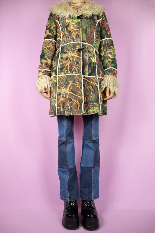 The Y2K Green Penny Lane Coat is a vintage abstract forest graphic printed jacket with beige faux fur collar and cuffs, pockets and toggle closure. Cyber boho 2000s afghan style winter statement coat.