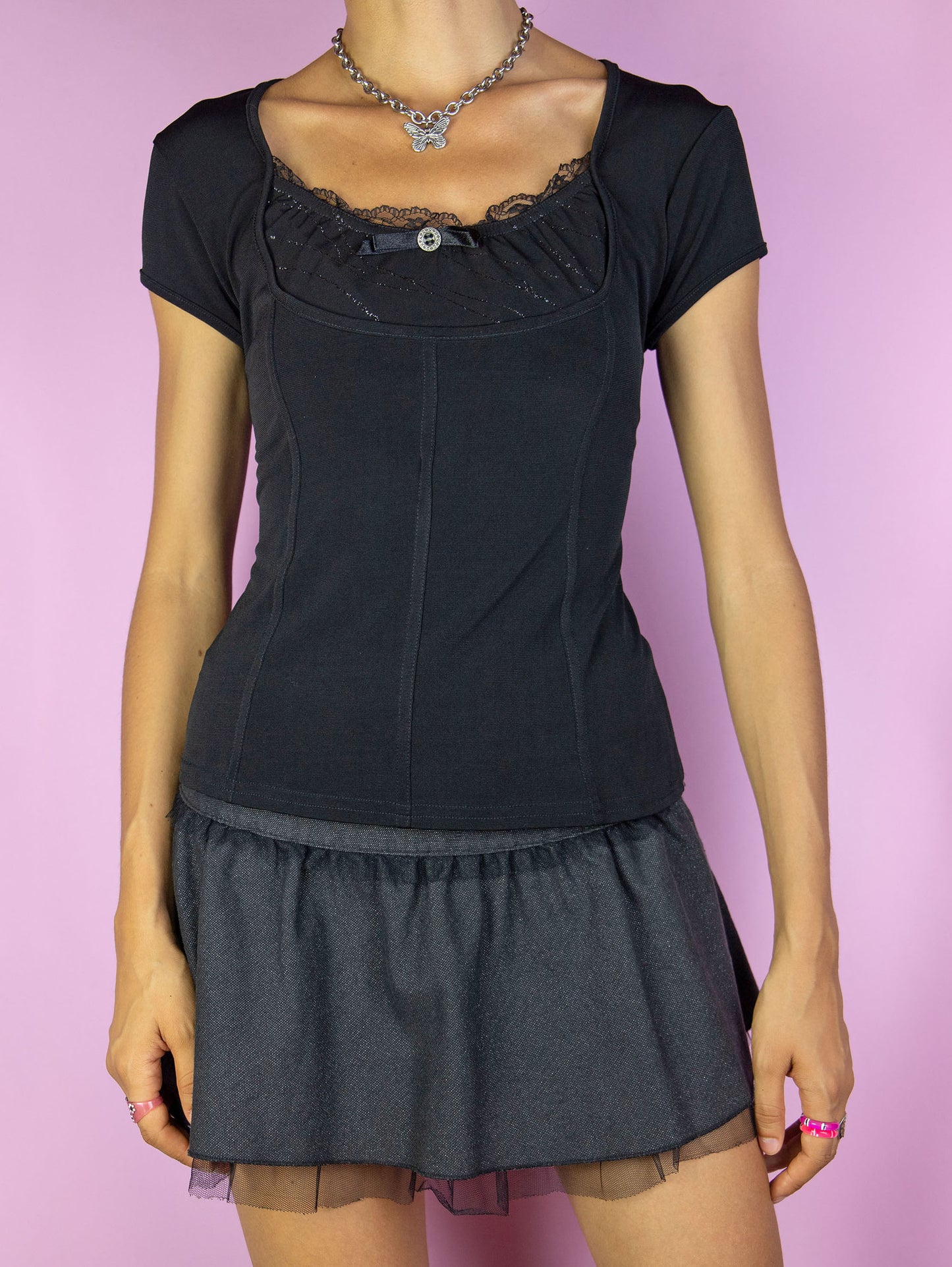 The Y2K Black Gothic Top is a vintage 2000s dark romantic fairy grunge inspired short sleeve top with lace detail.