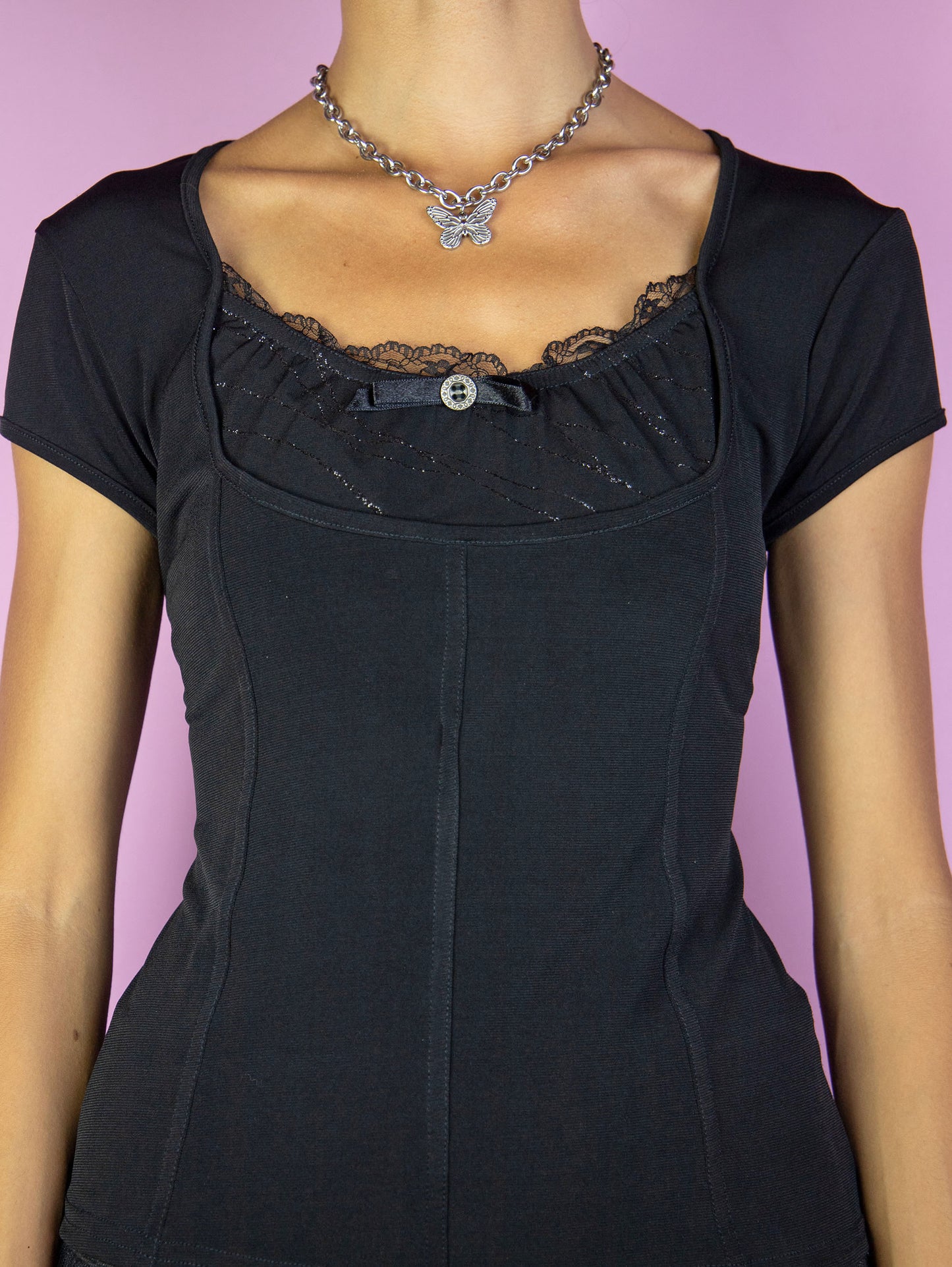 The Y2K Black Gothic Top is a vintage 2000s dark romantic fairy grunge inspired short sleeve top with lace detail.