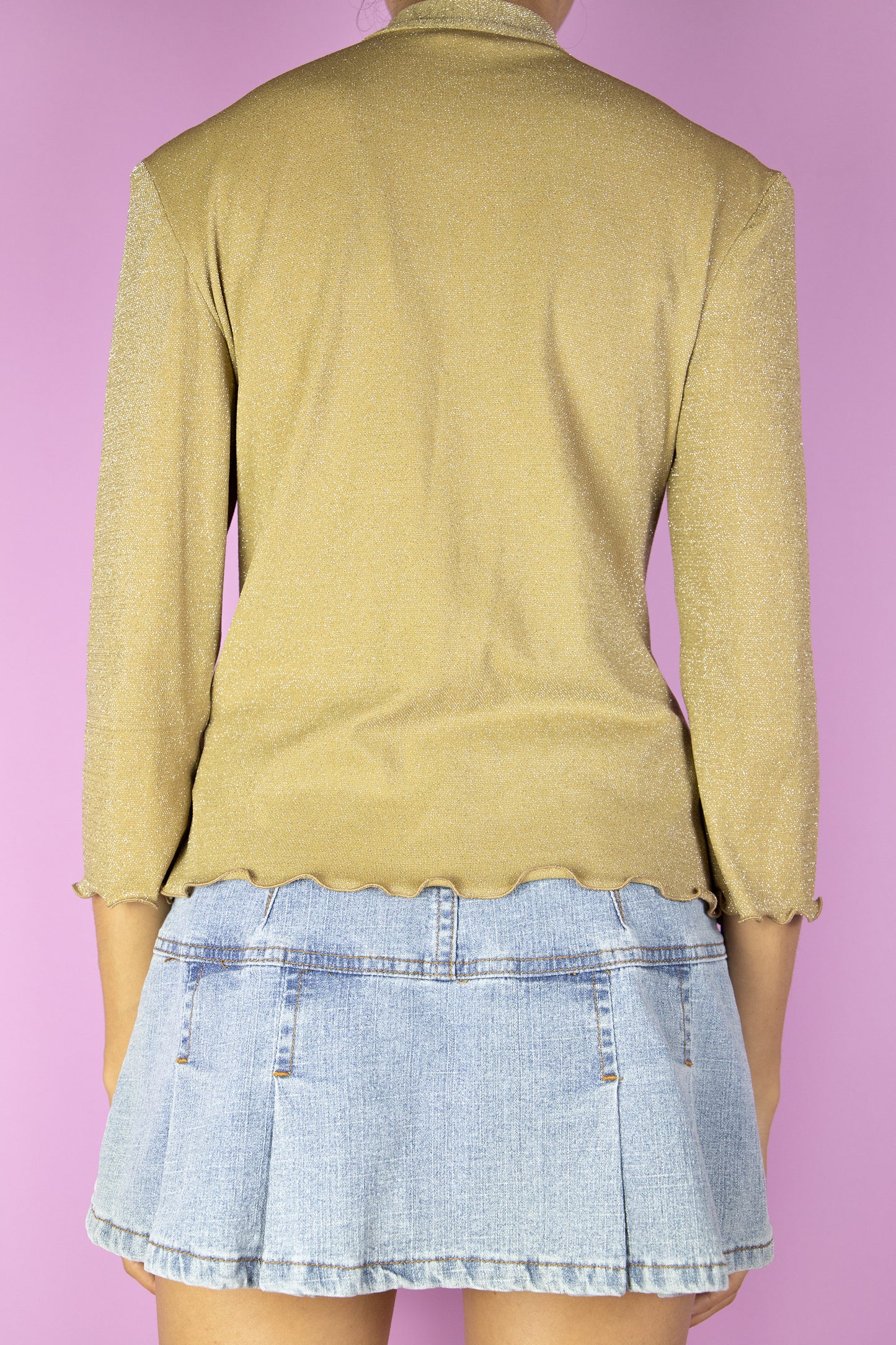 The Vintage 90s Gold Sparkle Top is a shiny golden stretchy top featuring a tie neck. Elegant 1990s evening party glam blouse.