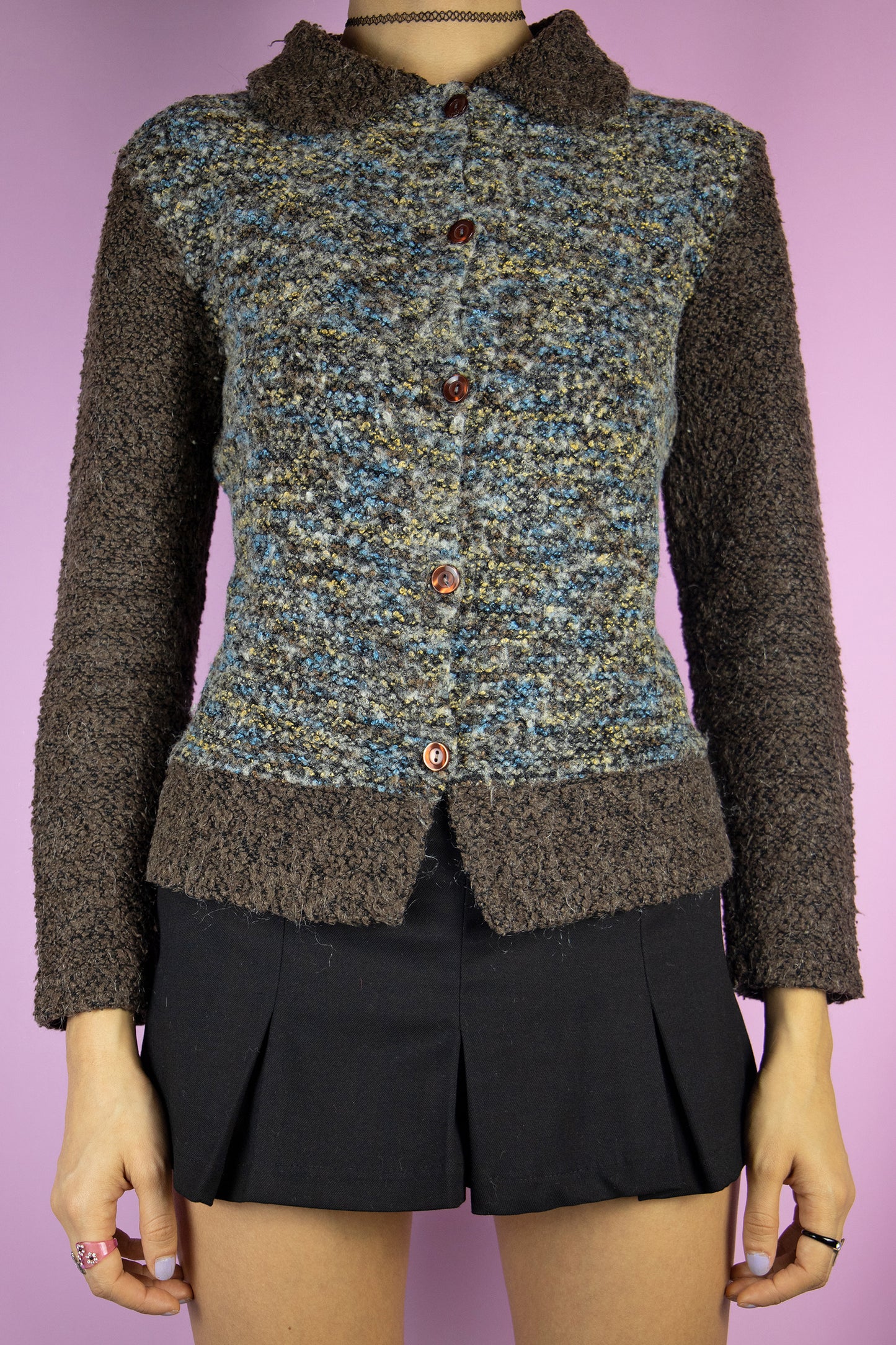 The Vintage 90s Fairy Grunge Brown Cardigan is a dark brown, beige, and blue wool blend knit sweater featuring a collar and buttons. Boho and cozy, it's perfect for casual autumn outfits.