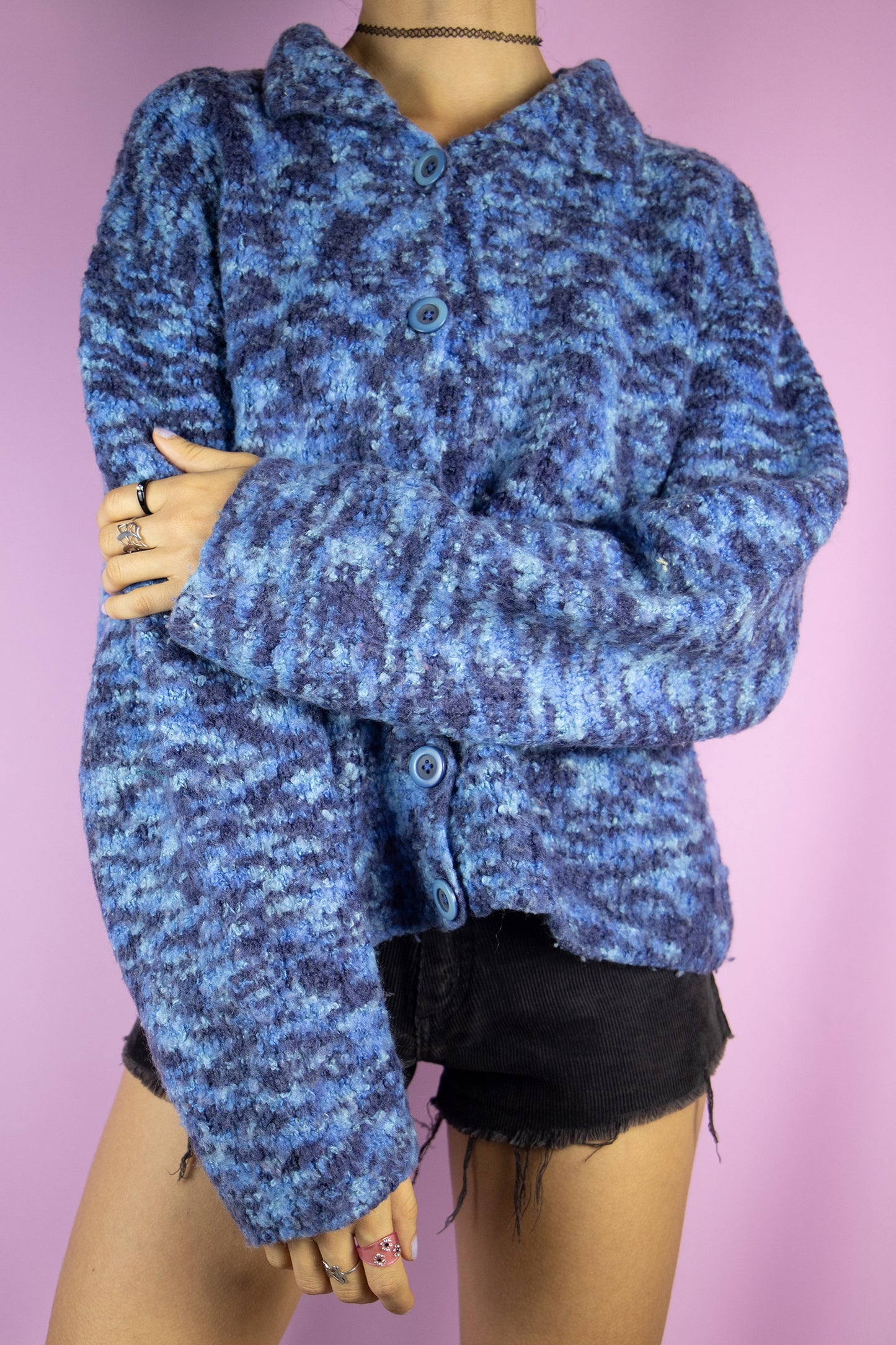 The Vintage 90s Boho Blue Cardigan is a chunky knit blue cardigan with a collar and buttons. Retro grunge 1990s winter sweater.