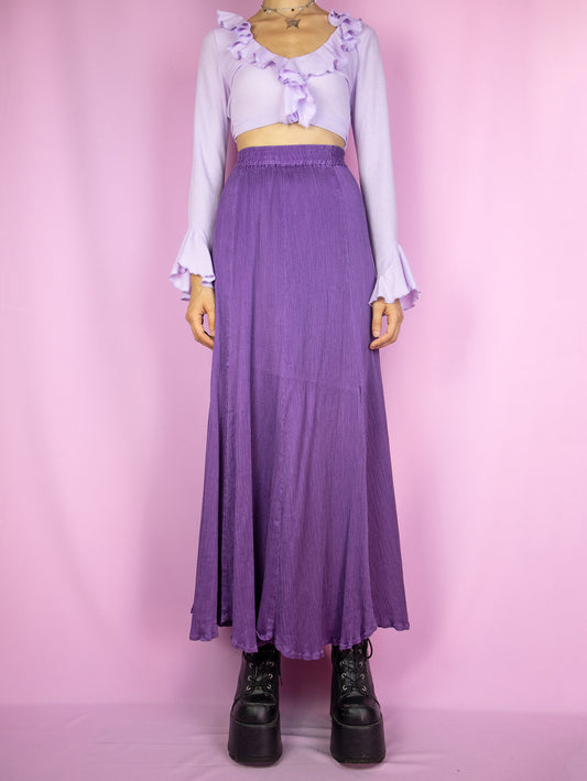 The Vintage 90s Purple Pleated Maxi Skirt is an elegant, flowy, full midi skirt with an elastic waist.