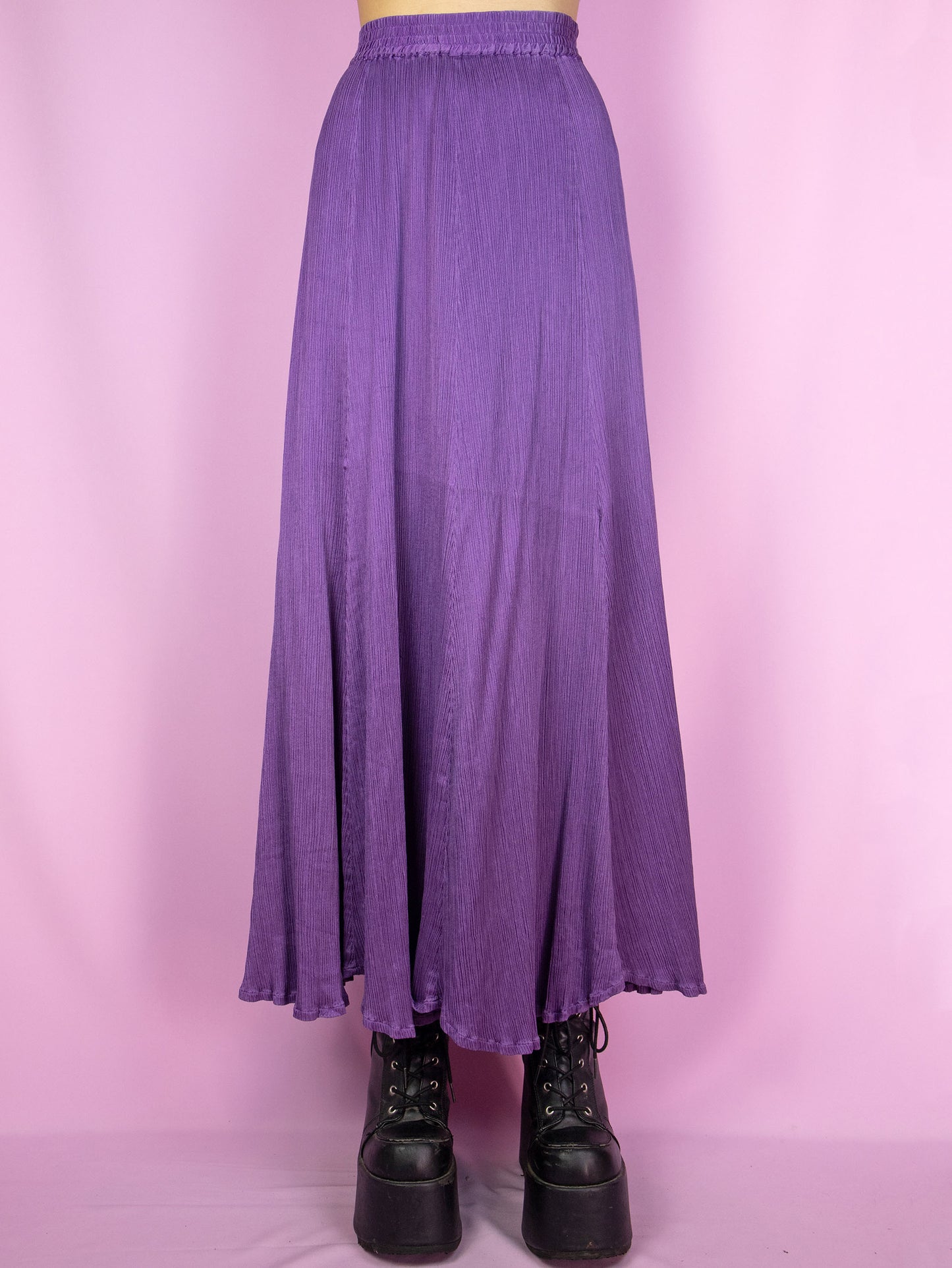 The Vintage 90s Purple Pleated Maxi Skirt is an elegant, flowy, full midi skirt with an elastic waist.