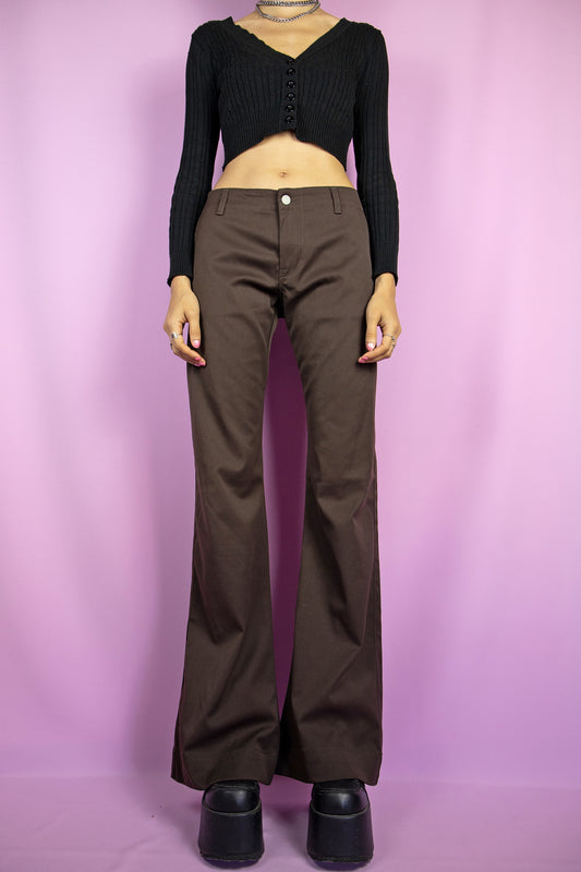The Y2K Brown Flare Jeans are vintage mid-rise stretchy flare brown pants with pockets. Cyber grunge 2000s wide pants.