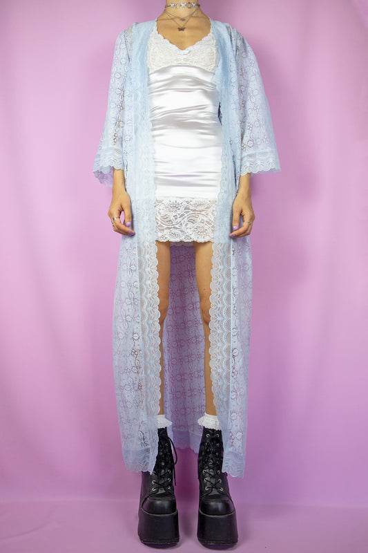 The Vintage 80s Romantic Lace Duster Jacket is a pastel light blue semi-sheer three-quarter sleeve long maxi robe. Flowy ethereal 1980s boho peignoir jacket.