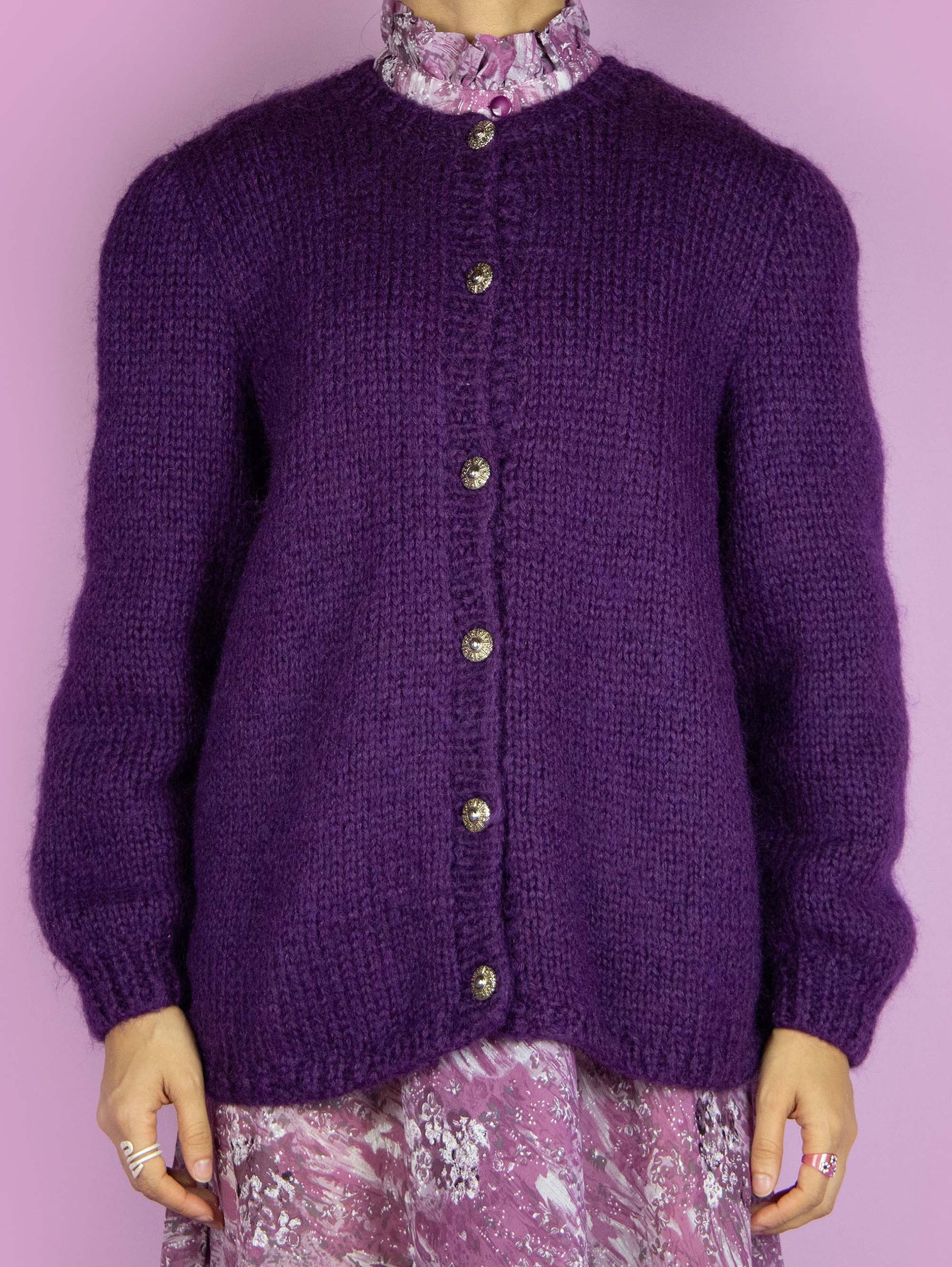 The Vintage 90s Dark Purple Knit Cardigan is a chunky knit purple cardigan with buttons. Boho retro 1990s winter knitted sweater.