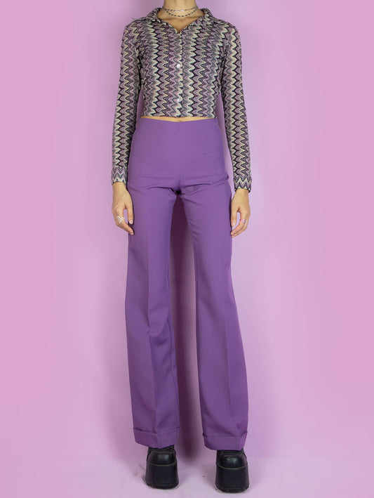 The Vintage 90s Purple Wide Trousers are high-waisted wide purple pants with a side zipper closure. Elegant tailored style 1990s classic pleated trousers.