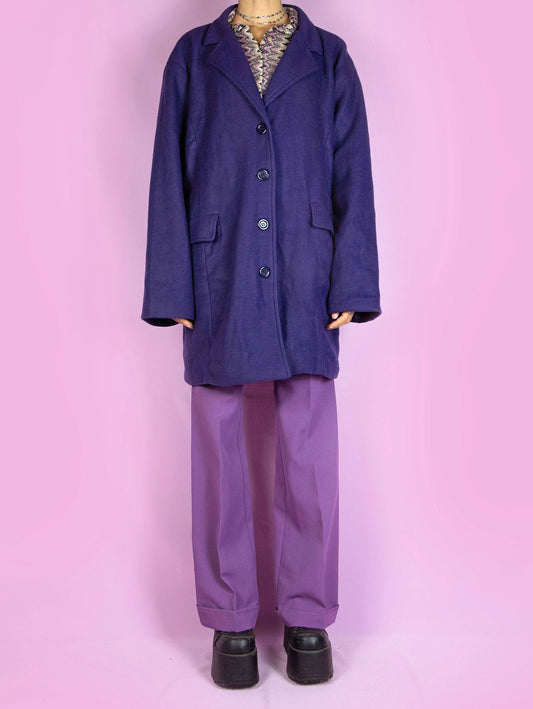 The Y2K Purple Blazer Jacket is a vintage dark purple blazer-style jacket with a collar, pockets, and buttons. Classic preppy 2000s office coat.