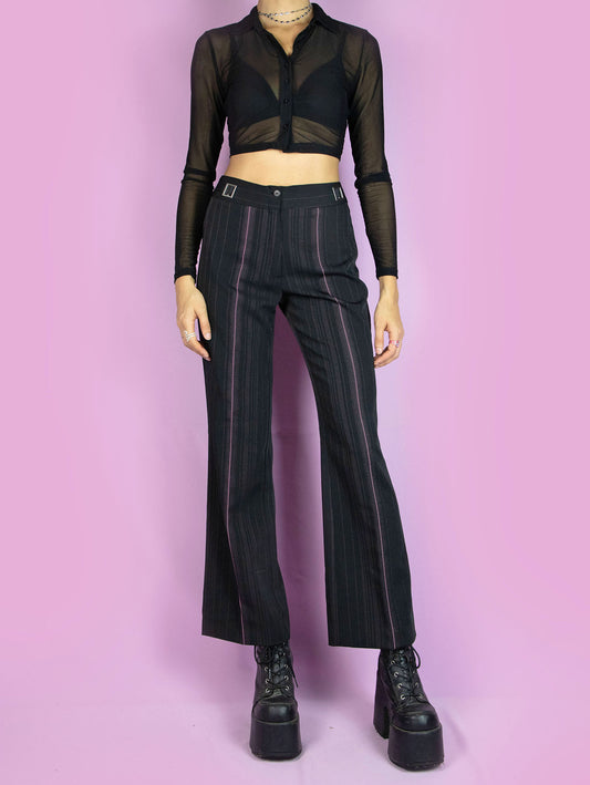 The Y2K Black Pinstripe Trousers are vintage high-waisted straight black and pink pinstripe pants, slightly elastic, with pleats and a front zipper closure. Elegant tailored style 2000s office pleated striped trousers.