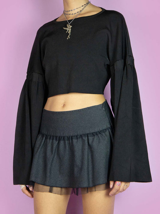 The Y2K Black Wide Sleeve Sweater is a vintage cropped black top with extra-wide long sleeves. Cyber goth 2000s subversive top.