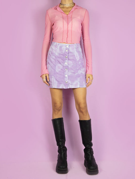The Y2K Tie Dye Denim Mini Skirt is a vintage lilac and blue skirt with pockets and buttons. Cyber harajuku festival 2000s pastel purple bleached mini skirt.