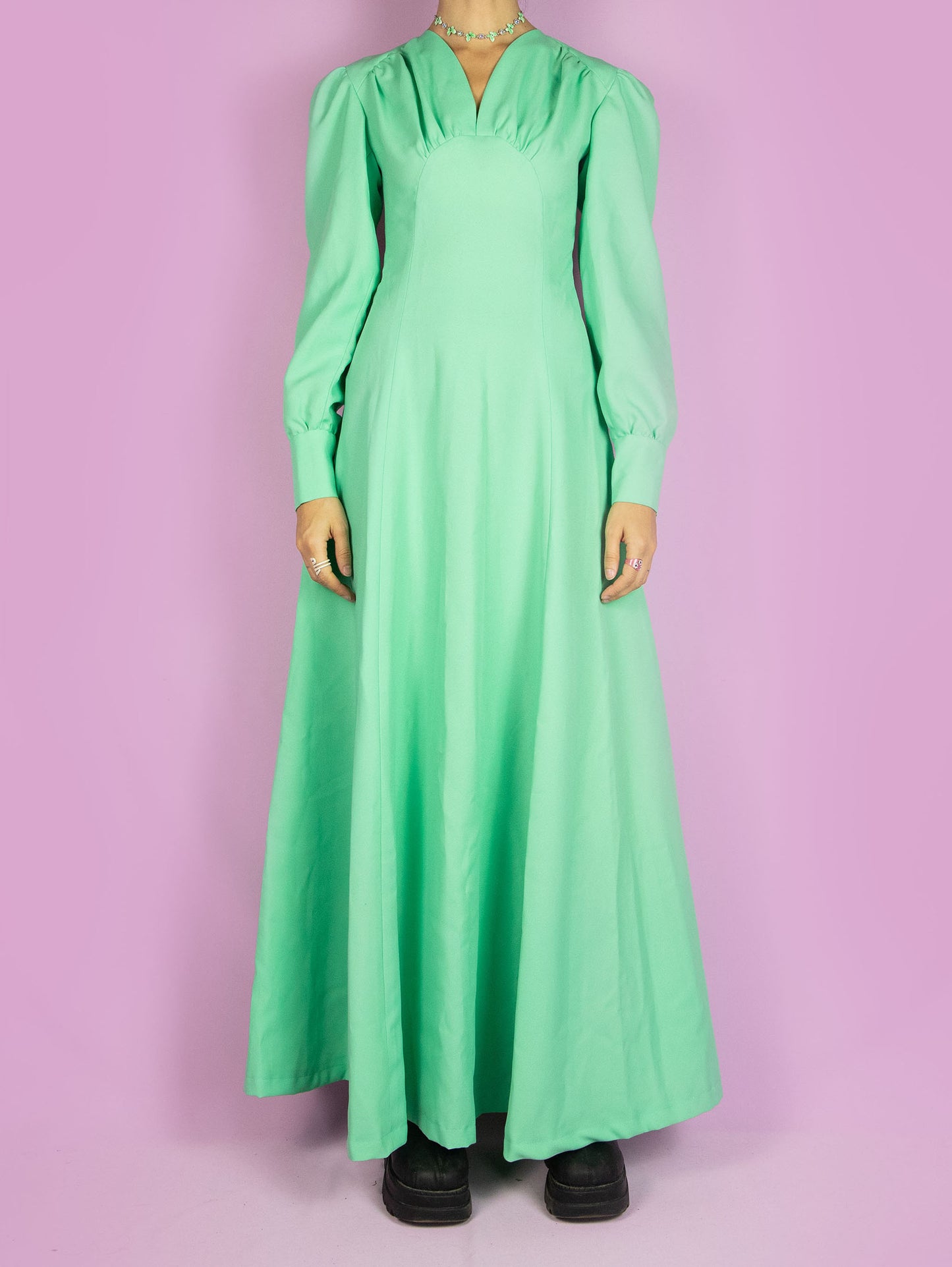 The Vintage 70s Balloon Sleeve Maxi Dress is a light turquoise dress with a gathered front and a zipper closure at the back. Cocktail party 1970s evening midi dress.