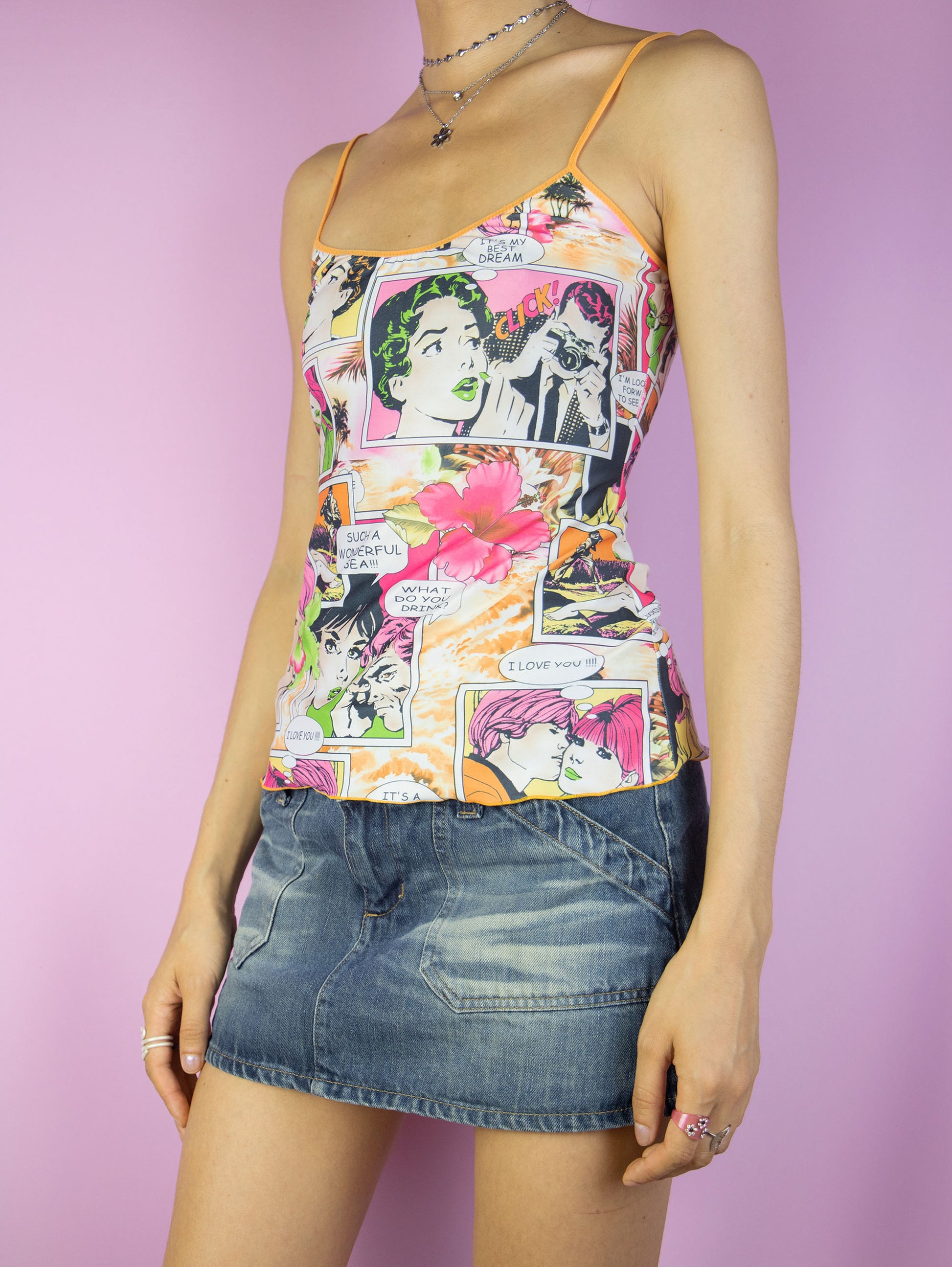The Y2K Cartoon Comic Graphic Top is a vintage multicolored tank top with a cartoon comic print. Cyber retro 2000s summer top.
