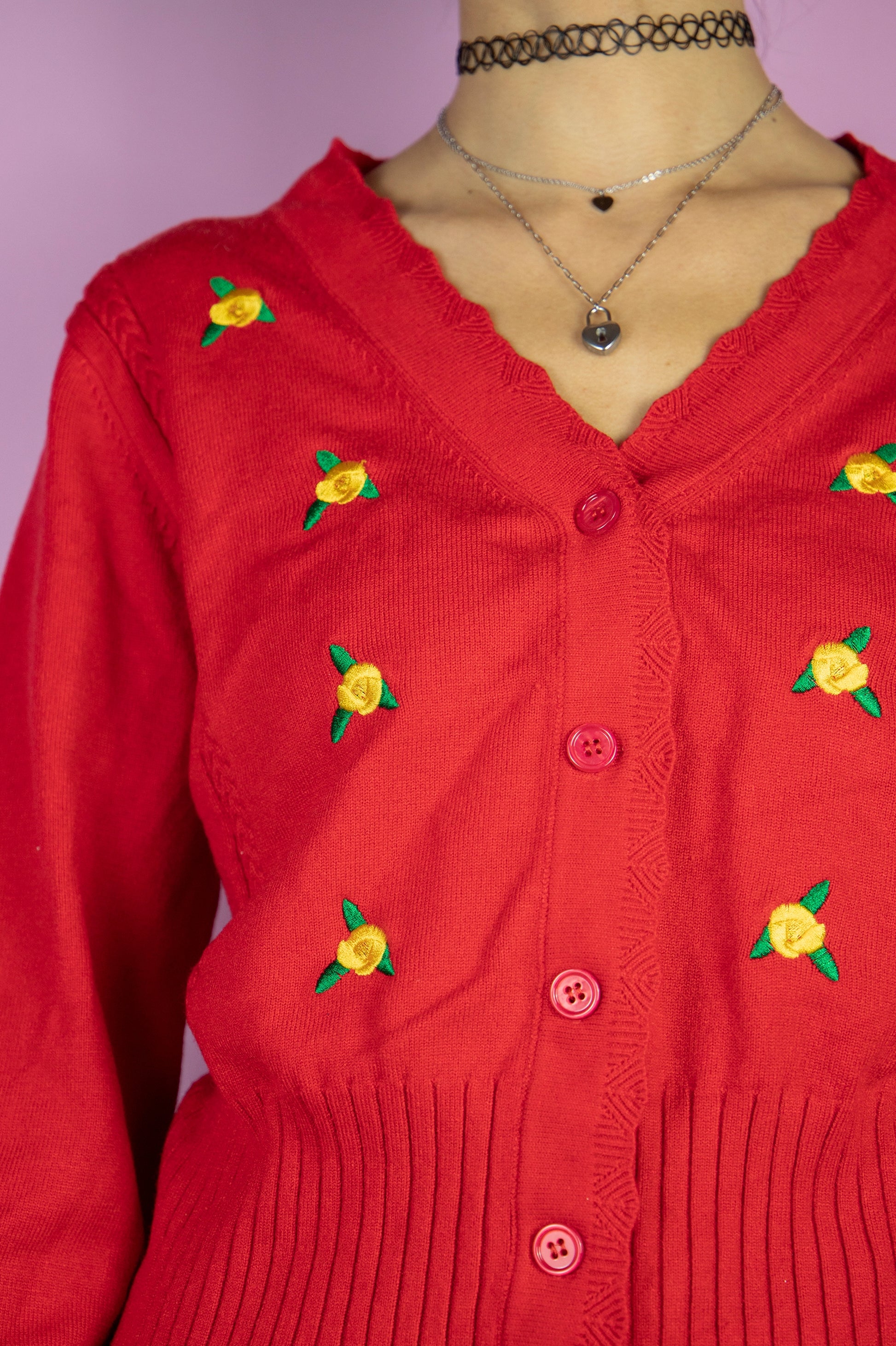 The Vintage 90s Red Floral Knit Cardigan is a cardigan adorned with embroidered floral details. Boho retro 1990s knitted sweater.