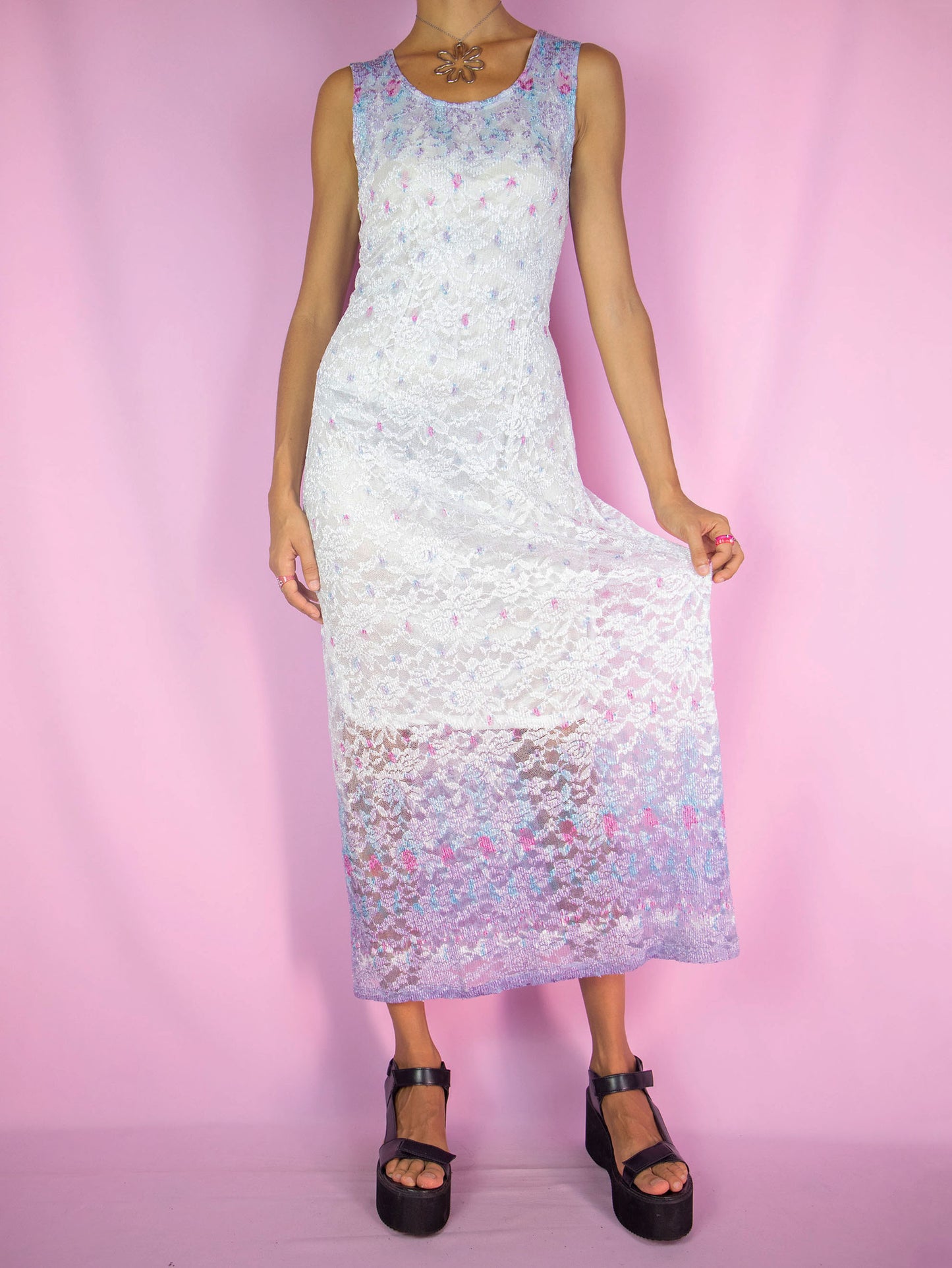The Y2K White Lace Maxi Dress is a vintage sleeveless semi-sheer mesh lace white lilac multicolored dress that is tied at the back. Romantic summer party 2000s midi dress.