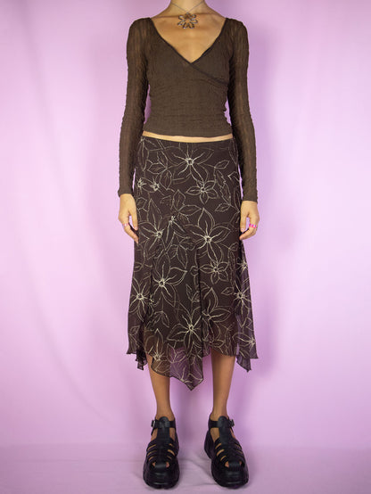 The Y2K Fairy Brown Midi Skirt is a vintage dark brown floral asymmetrical pointed skirt with elastic waist. Dark romantic whimsygoth 2000s grunge midi skirt.