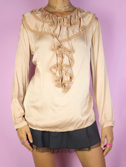 The Y2K Elegant Ruffle Blouse is a vintage shiny rose gold top with a ruffled collar and buttons. Romantic 2000s evening party shirt.