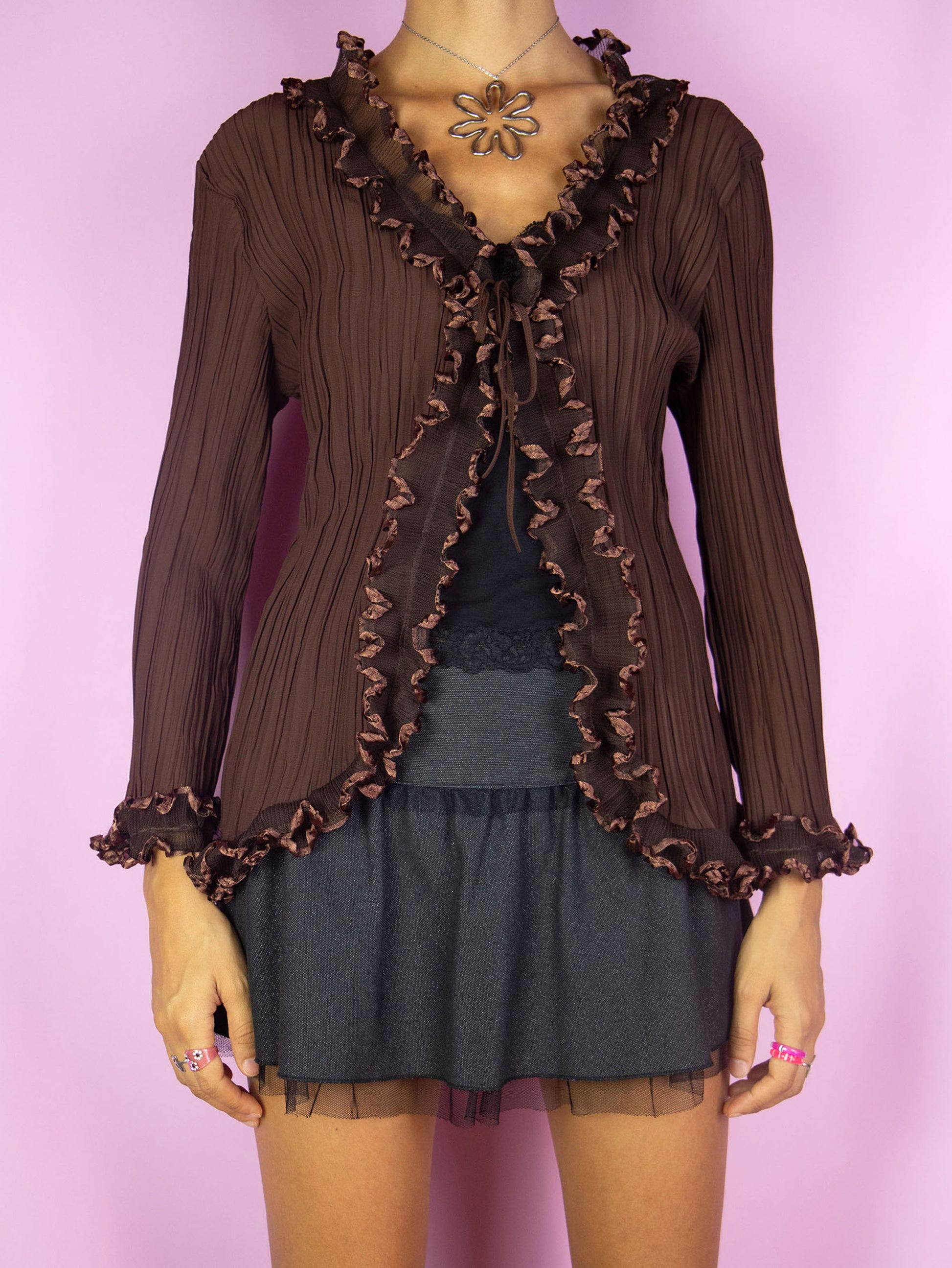 The Y2K Dark Brown Ruffle Blouse is a vintage pleated dark brown tied front top with ruched ruffle details. Avant garde boho fairy grunge 2000s bolero jacket.