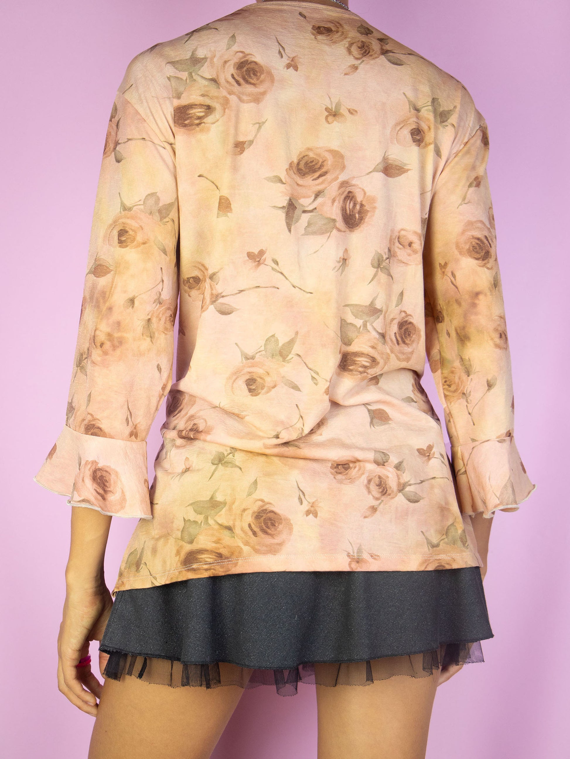 The Y2K Romantic Ruffle Top is a vintage pink rose gold three-quarter bell sleeve floral printed blouse with a ruffled collar. Boho fairy grunge 2000s summer top. Made in Spain.
