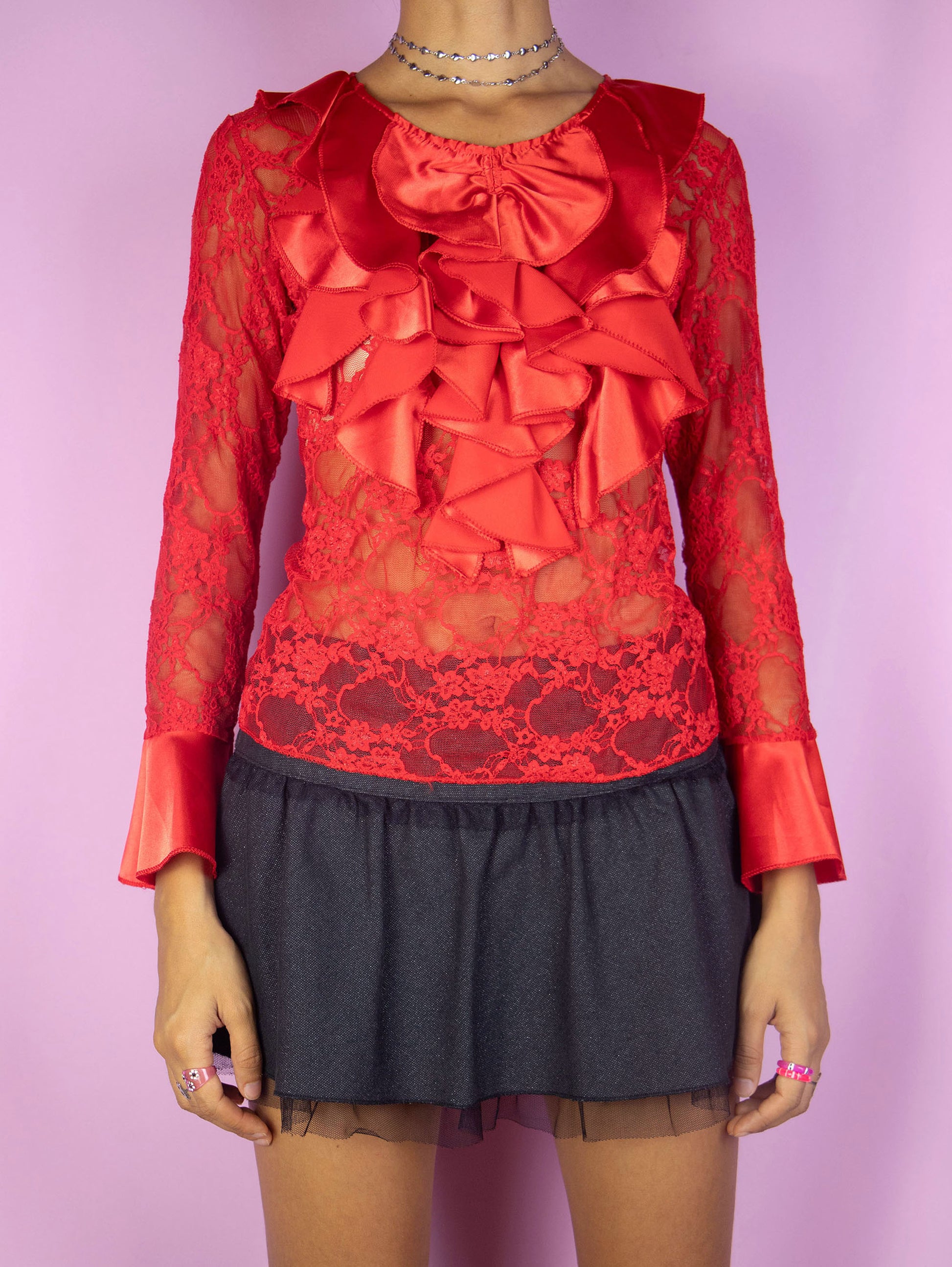 The Y2K Red Ruffle Lace Top is a vintage bell sleeve semi-sheer lace mesh red blouse with ruffle collar. Romantic avant garde 2000s shirt.