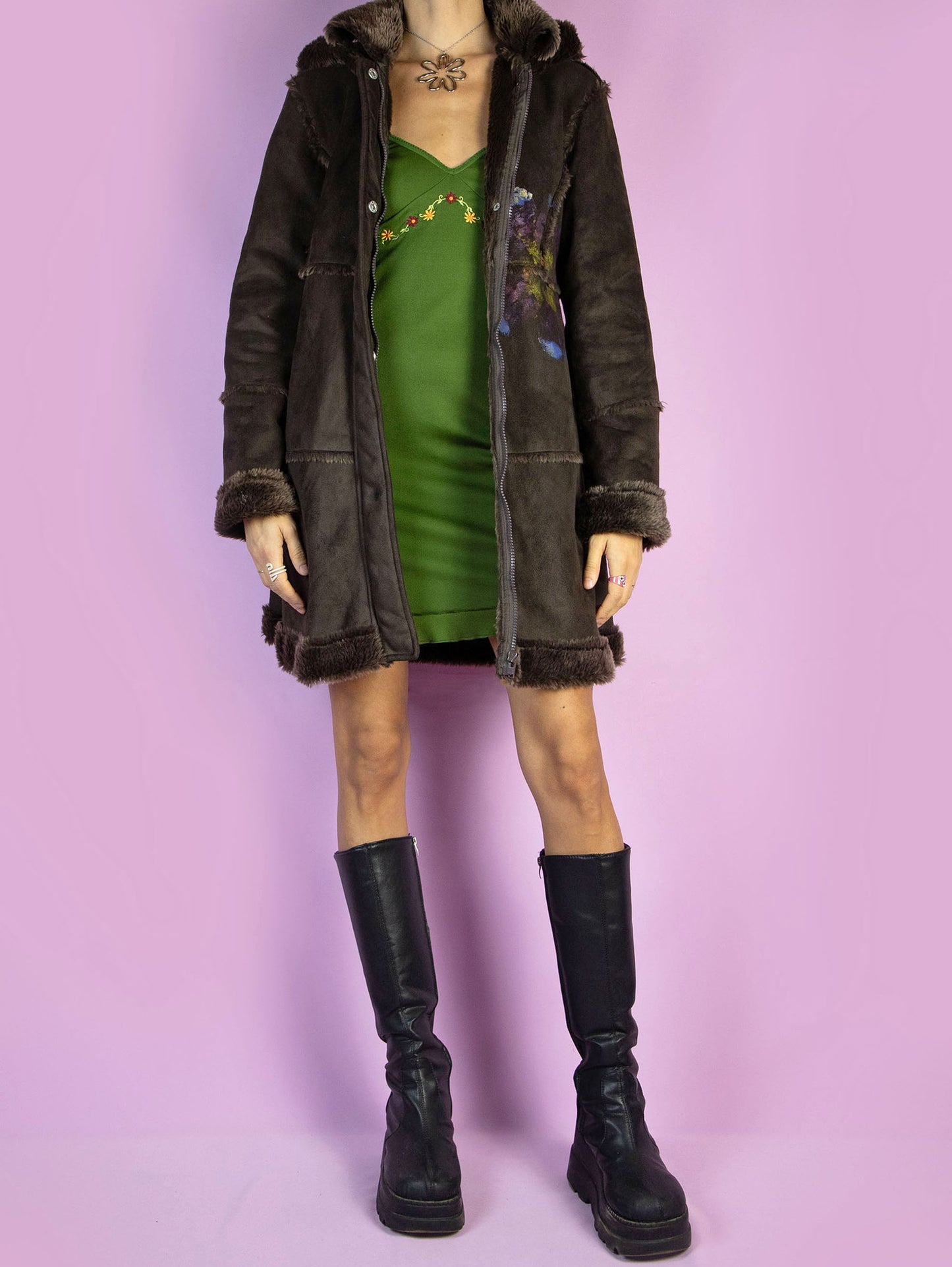 The Y2K Dark Brown Penny Lane Coat is a vintage faux suede coat with a collar, cuffs, and faux fur lining, zipper closure, and a hood. Fairy Grunge whimsygoth 2000s afghan-inspired winter statement jacket.