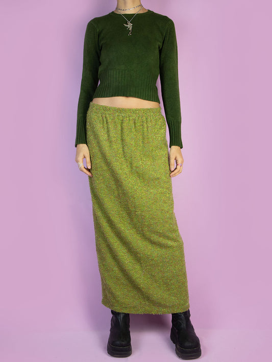 The Vintage 90s Green Knit Midi Skirt is a long winter skirt with an elastic waistband and a back slit. Boho 1990s knitted maxi skirt.