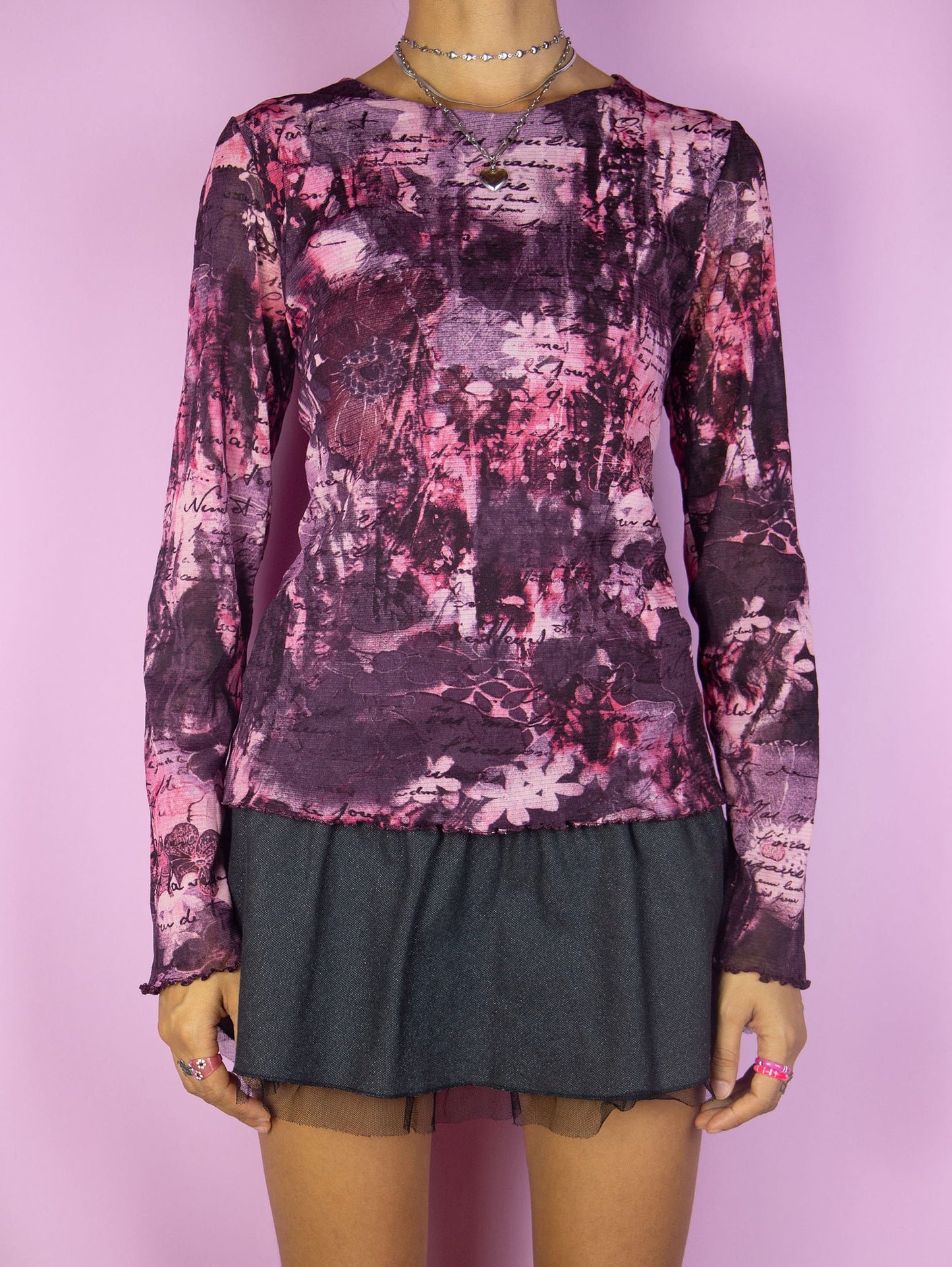 The Vintage Y2K Purple Abstract Mesh Top is a dark purple maroon and pink floral abstract print semi-sheer mesh lettuce hem long sleeve top. Super cute cyber fairy grunge gorpcore shirt circa 2000's.