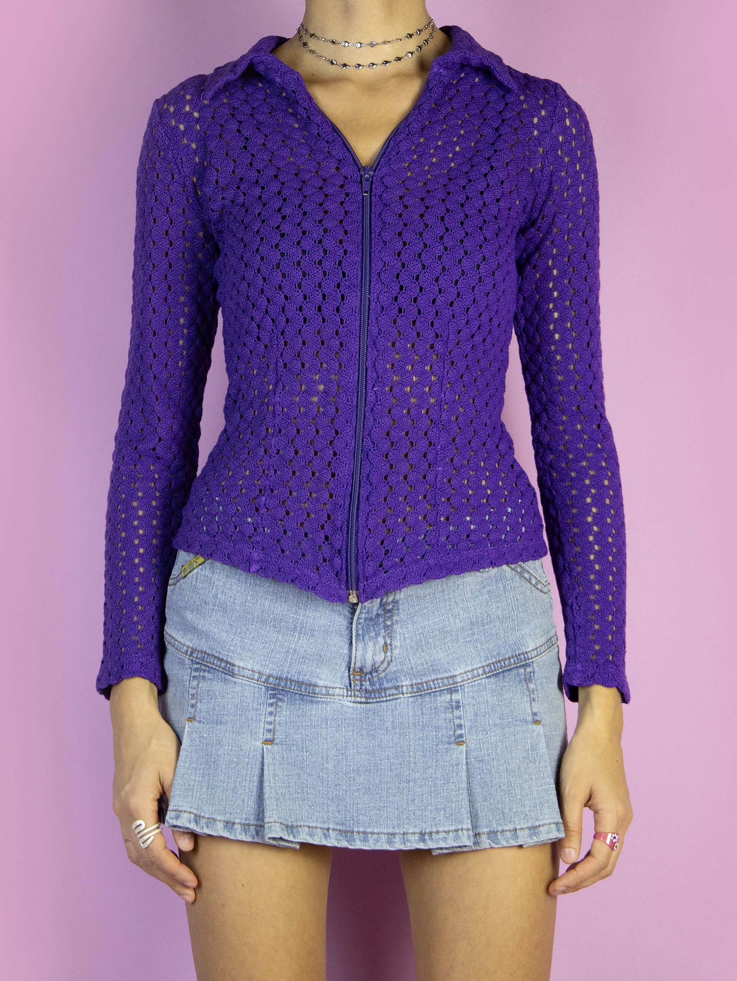 The Y2K Purple Zipper Knit Cardigan is a vintage purple top with a collar and front zipper closure. Boho fairy grunge 2000s crochet knit sweater.