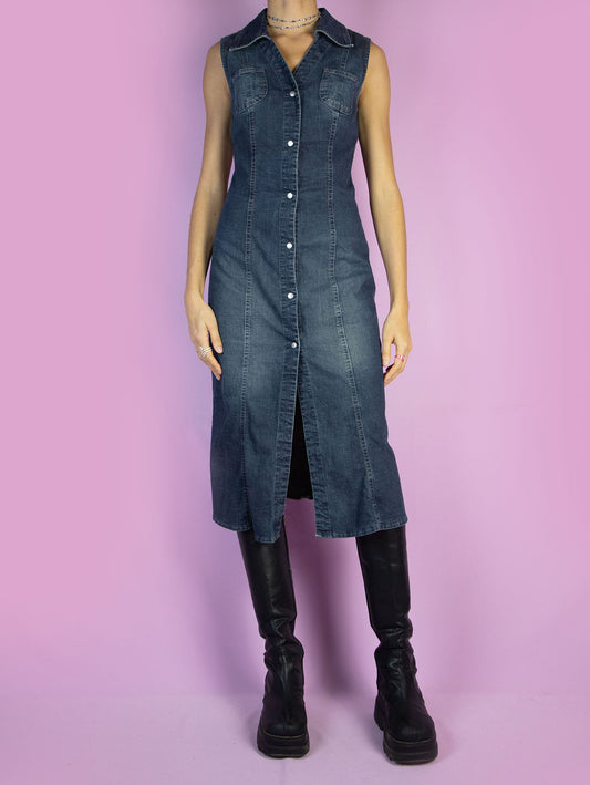 The Y2K Button Denim Midi Dress is a vintage slightly stretchy blue sleeveless dress with a collar and button closure. Cyber streetwear 2000s jean maxi dress.