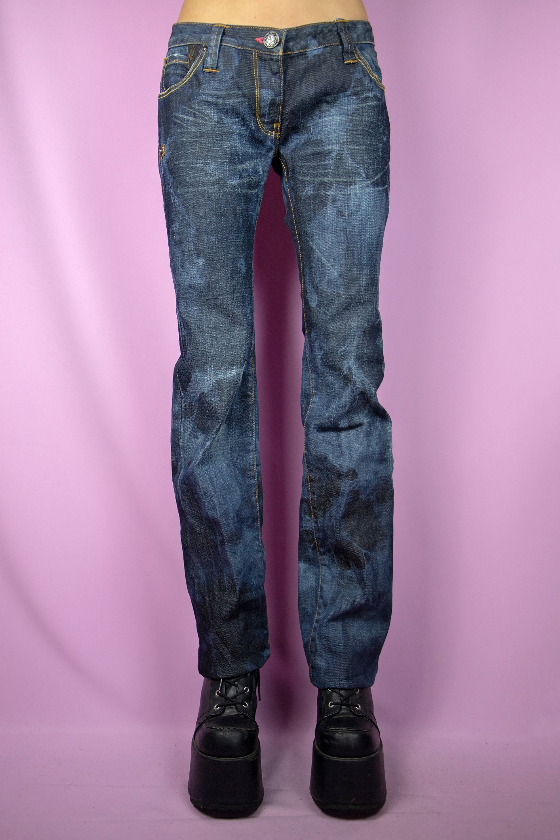 The Y2K Low Rise Bleach Jeans are vintage tie-dye bleached straight pants with pockets, a raw hem, and a subtle stretch. Cyber grunge 2000s dark denim pants.