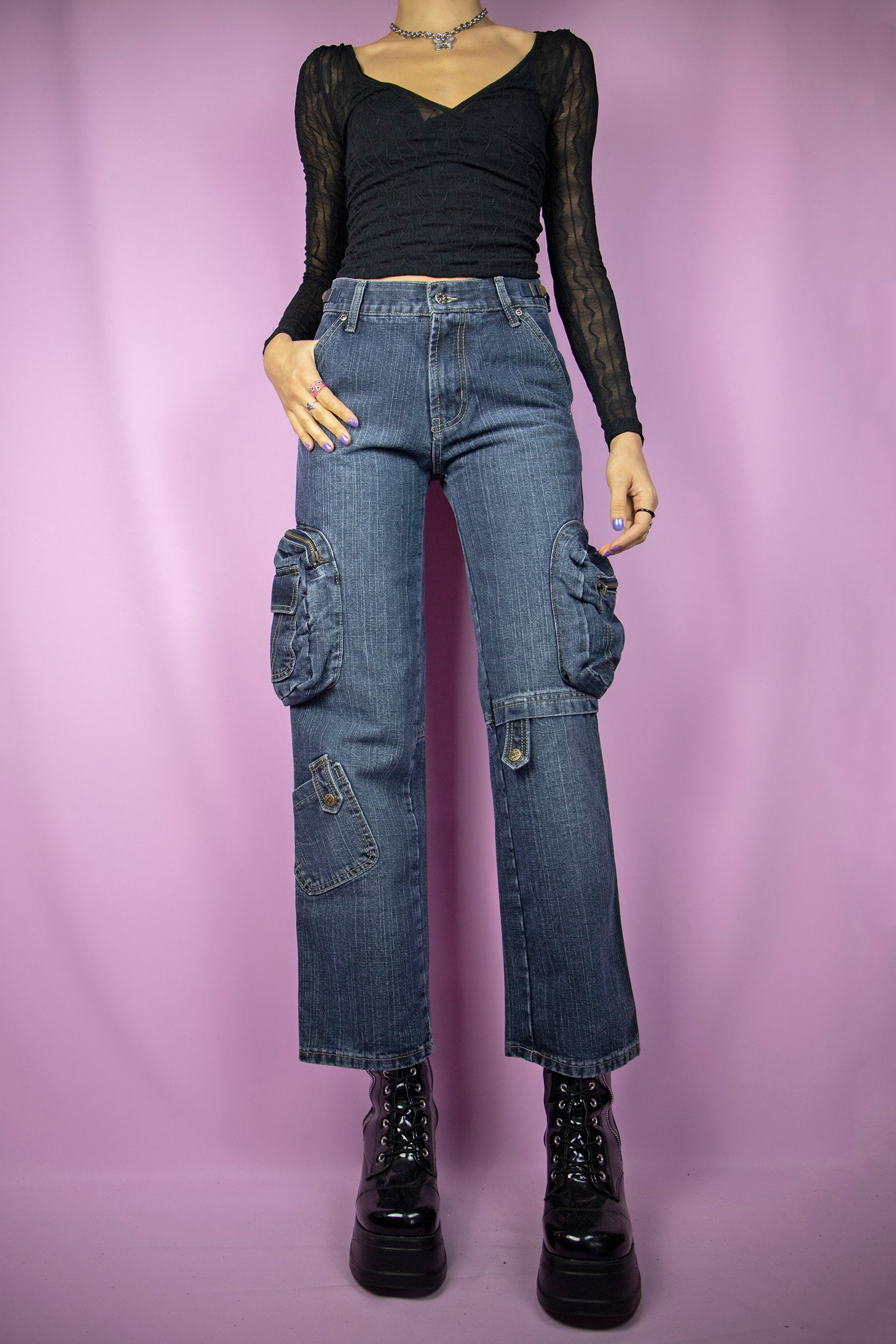 The Y2K Cargo Wide Jeans are vintage 2000s mid-rise utility dark denim pants with pockets.